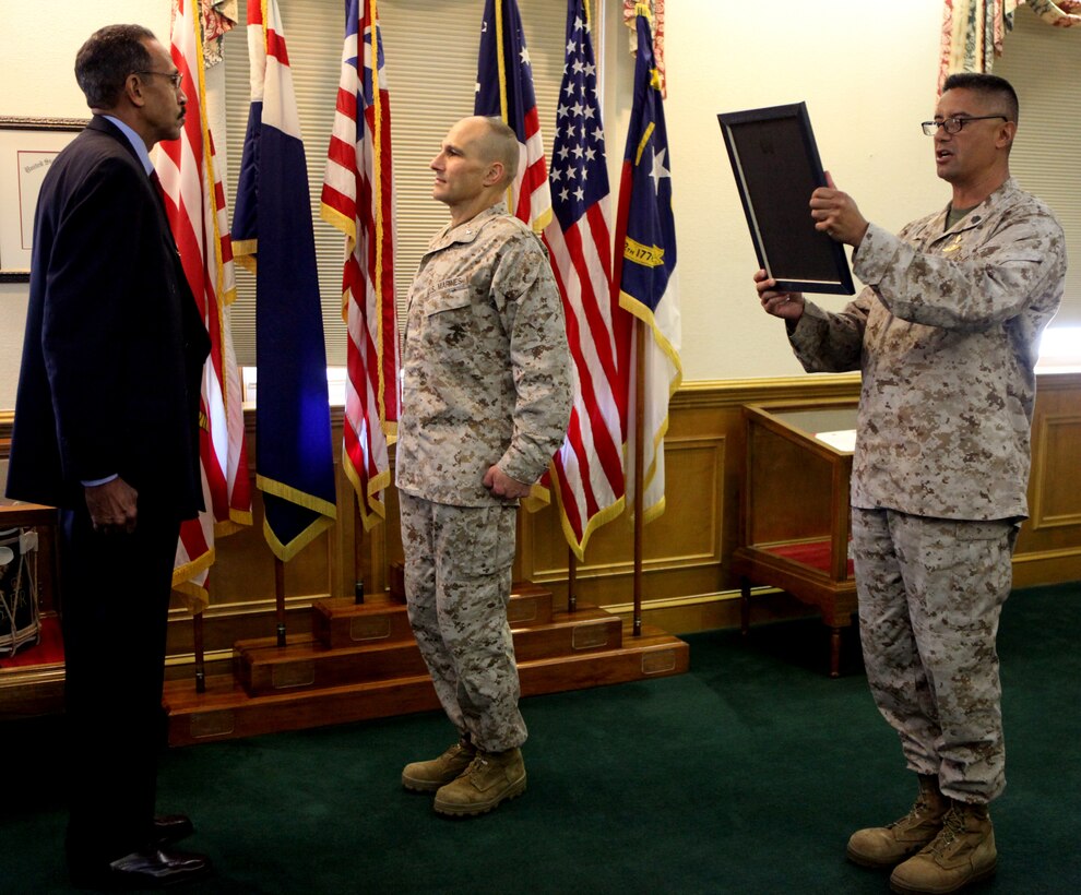Sgt. Maj. Ernest K. Hoopii, sergeant major of Marine Corps Installations East – Marine Corps Base Camp Lejeune, reads Trafford B. Taylor’s official citation for his Career Service Award at the installation headquarters aboard MCB Camp Lejeune Sept. 12 after serving in the military and working as a hazardous communications and inspection program manager for 40 years. Brig. Gen. Thomas A. Gorry, commanding general of MCI East – MCB Camp Lejeune, presented Taylor with the award.