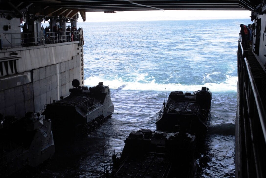 U.S. Marines with Alpha Company, 3D Amphibian Assault Battalion, 15TH Marine Expeditionary Unit, land their AAVPV7 amphibious assault crafts on to the well deck aboard the USS Comstock (LSD-45), Mar. 26, 2012. The landing is part of a 12 nautical-mile test to prove the vehicle's capabilities and viability to the U.S. Marine Corps. (U.S. Marine Corps photo by Lance Cpl. Jonathan Ross Waldman/Not Reviewed)
