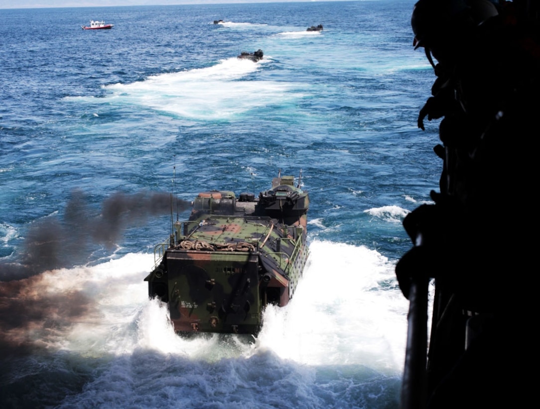 U.S. Marines with Alpha Company, 3D Amphibian Assault Battalion, 15TH Marine Expeditionary Unit, land their AAVPV7 amphibious assault crafts on to the well deck aboard the USS Comstock (LSD-45), Mar. 26, 2012. The landing is part of a 12 nautical-mile test to prove the vehicle's capabilities and viability to the U.S. Marine Corps. (U.S. Marine Corps photo by Lance Cpl. Jonathan Ross Waldman/Not Reviewed)