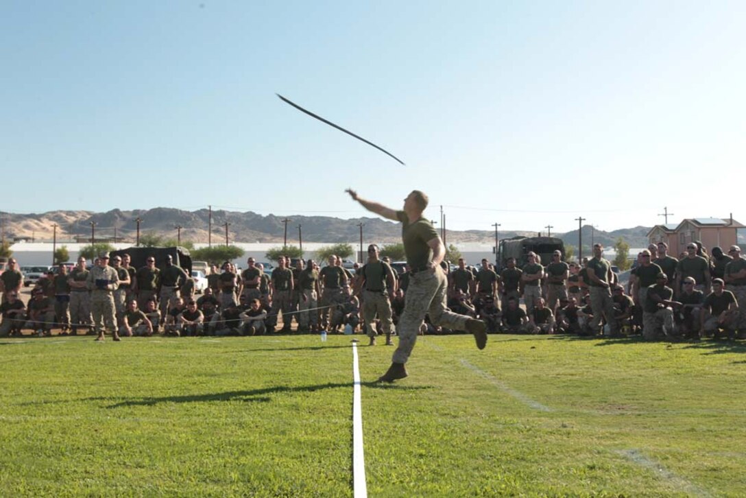 First Lt. MarkAnthony Villanueva, platoon commander, 1st Tank Battalion, takes the center position in the tug of war during the unitâ€™s field meet at Del Valle Field Aug. 31, 2012.