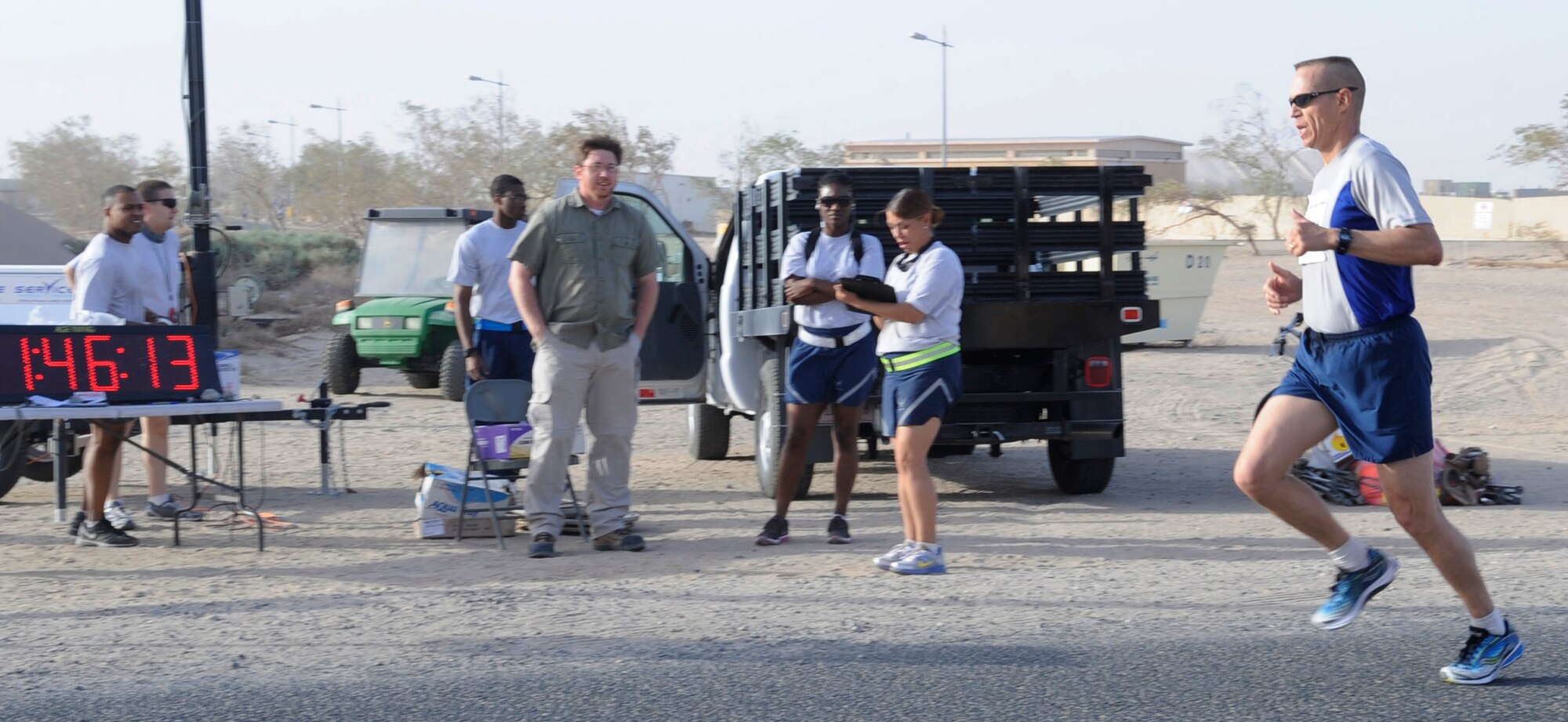 SOUTHWEST ASIA – Chief Master Sgt. Scott Maunu, 386th Expeditionary Mission Support Group superintendent, sprints to the finish line, completing 13.1 miles in the Air Force Marathon at one hour and 46 minutes Sept.15. Deployed members were able to register and run a 10K or half-marathon to participate in the Air Force Marathon. (U.S. Air Force photo/Staff Sgt. Alexandra M. Boutte)