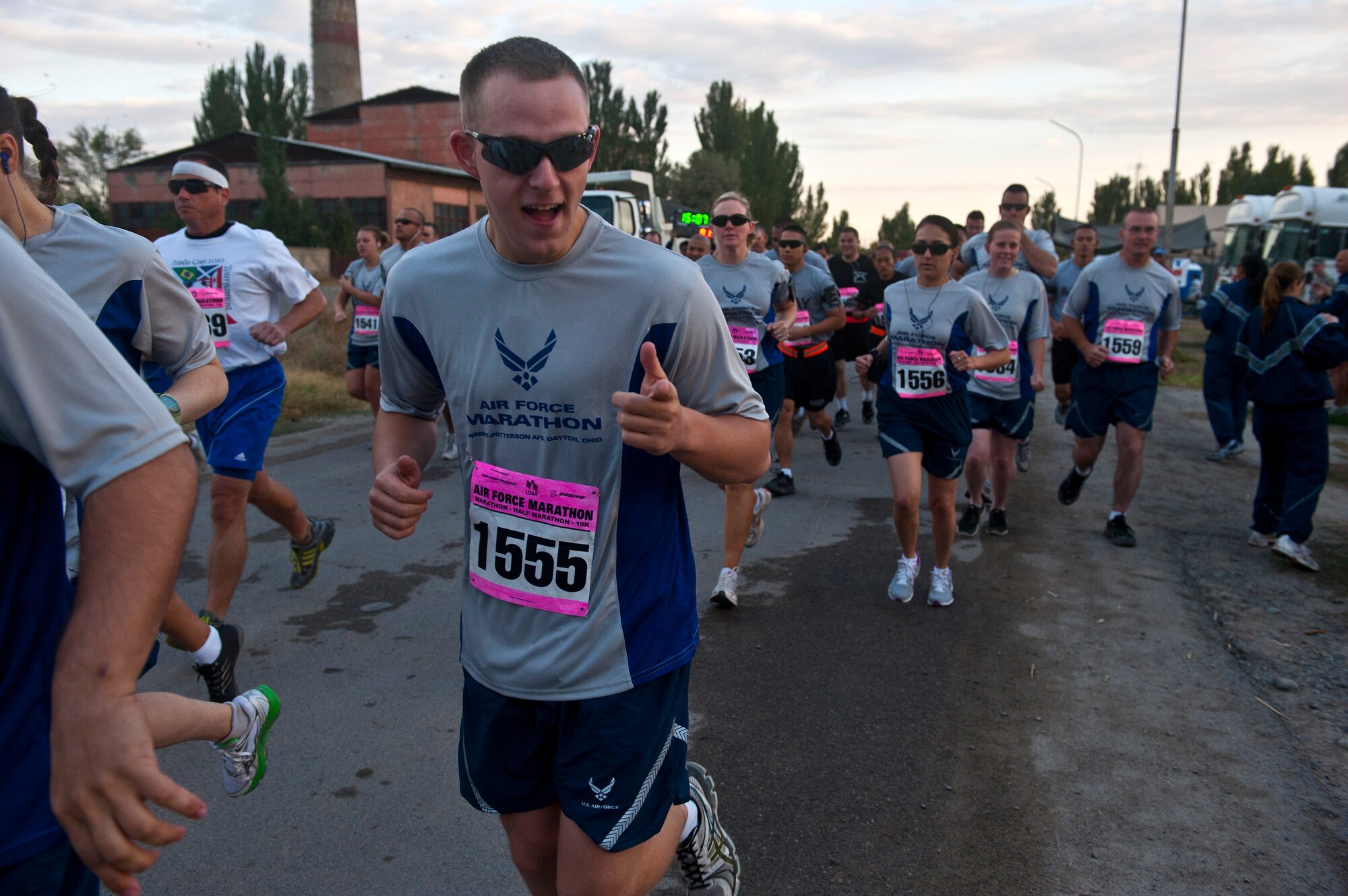 Senior Airman Matthew McGahey is excited to begin the Air Force Half-Marathon race at the Transit Center at Manas, Kyrgyzstan, Sept. 15, 2012. The participants were able to run a 10k, half- or full marathon race. McGahey is a 376th Expeditionary Mission Support Group project manager deployed from Moody Air Force Base, Ga. and is a native of Fort Wayne, Ind. (U.S. Air Force photo/Senior Airman Brett Clashman)