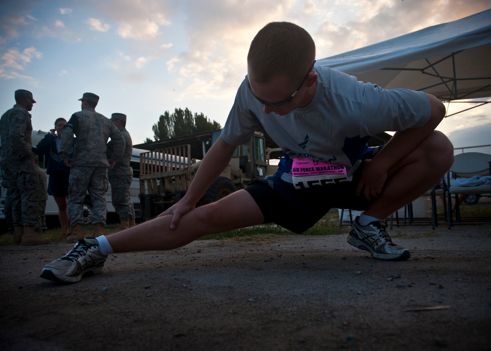 Senior Airman Matthew McGahey stretches before the Air Force Marathon at the Transit Center at Manas, Kyrgyzstan, Sept. 15, 2012. The marathon occurs across locations around the world in conjuction with the U.S. Air Force Marathon hosted annually at Wright Patterson Air Force Base, Ohio. McGahey is a 376th Expeditionary Mission Support Group project manager deployed from Moody Air Force Base, Ga. and is a native of Fort Wayne, Ind. (U.S. Air Force photo/Senior Airman Brett Clashman)