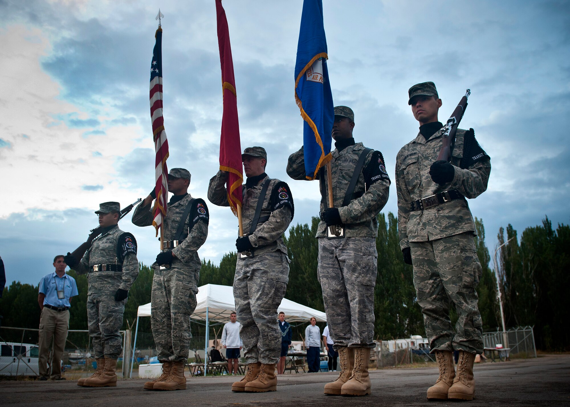 The Transit Center at Manas honor guardsmen post the Colors before the Air Force Marathon at the Transit Center at Manas, Kyrgyzstan, Sept. 15, 2012. More than 150 participants from the Transit Center and Manas International Airport ran in the 10k, half- and full marathon races. (U.S. Air Force photo/Senior Airman Brett Clashman)