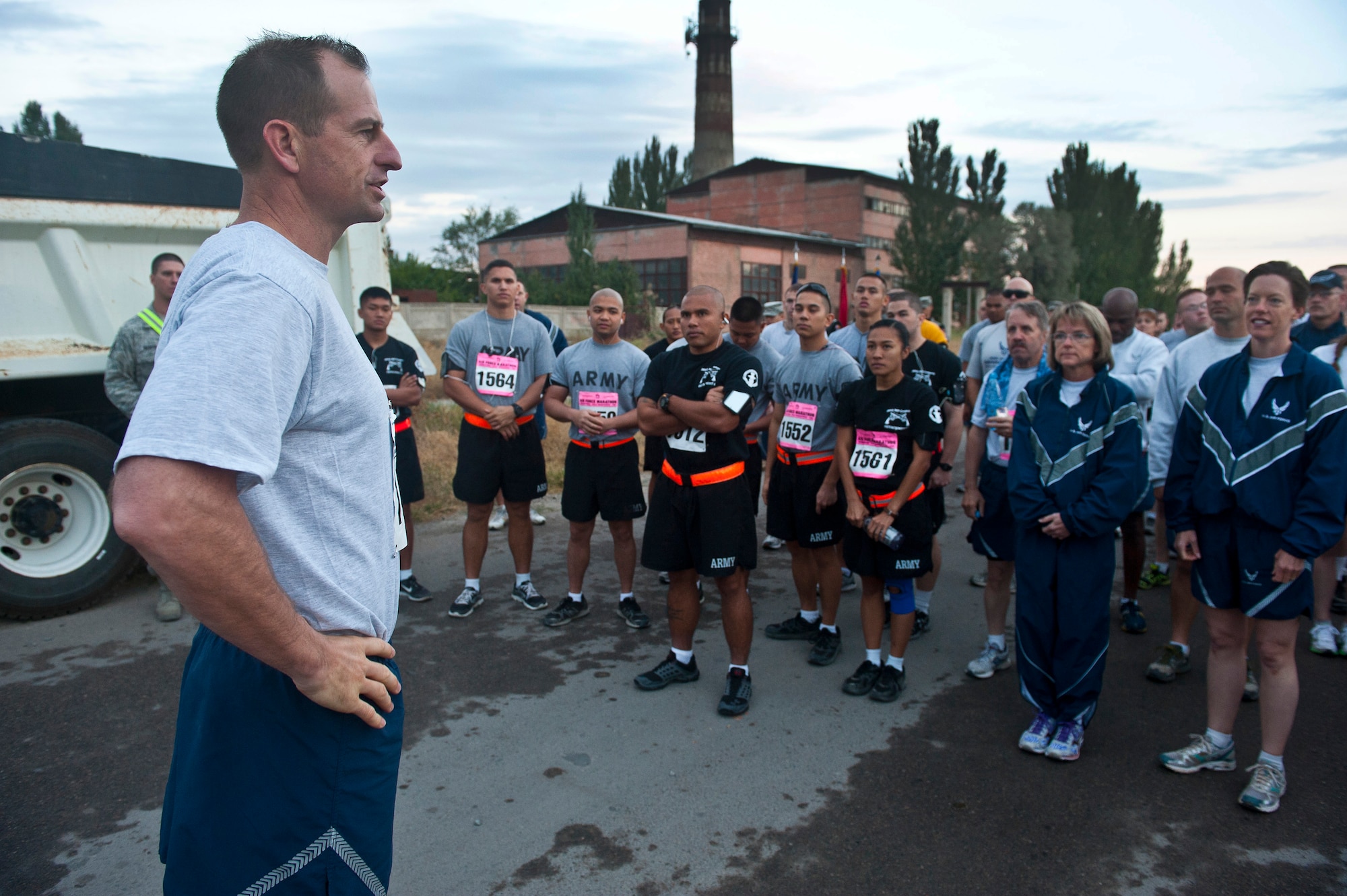 Col. Corey Martin addresses participants before the Air Force Marathon at the Transit Center at Manas, Kyrgyzstan, Sept. 15, 2012. The marathon occurs across locations around the world in conjuction with the U.S. Air Force Marathon hosted annually at Wright Patterson Air Force Base, Ohio. Martin is the 376th Air Expeditionary Wing commander. (U.S. Air Force photo/Senior Airman Brett Clashman)