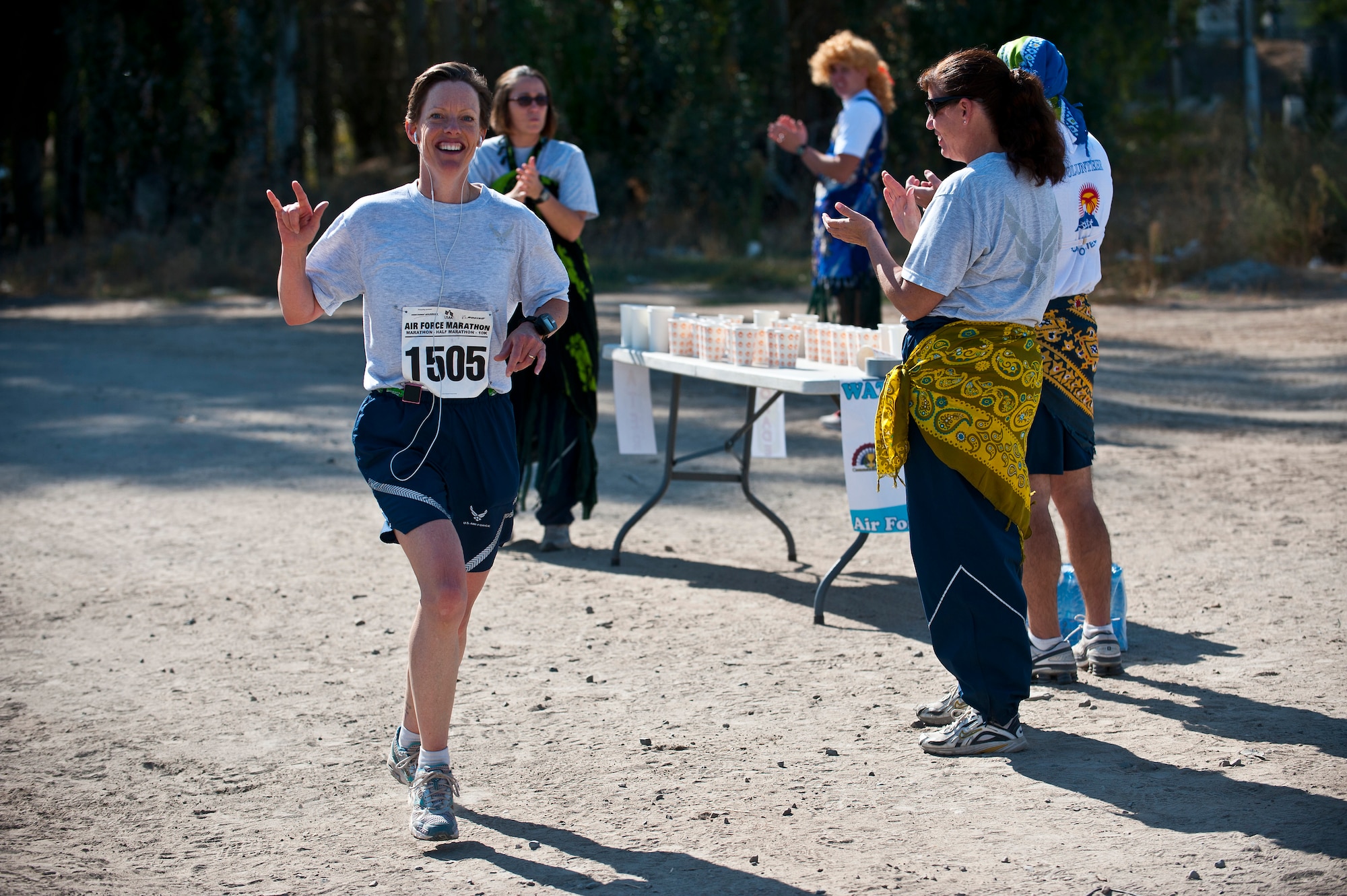 Lt. Col. Launa Bellucci runs towards the finish line during the Air Force Marathon at the Transit Center at Manas, Kyrgyzstan, Sept. 15, 2012. Bellucci was the first female to finish the full marathon with a time of 3:37:08. She is the 376th Expeditionary Mission Support Group deputy commander deployed from Ellsworth Air Force Base, S.D. (U.S. Air Force photo/Senior Airman Brett Clashman)