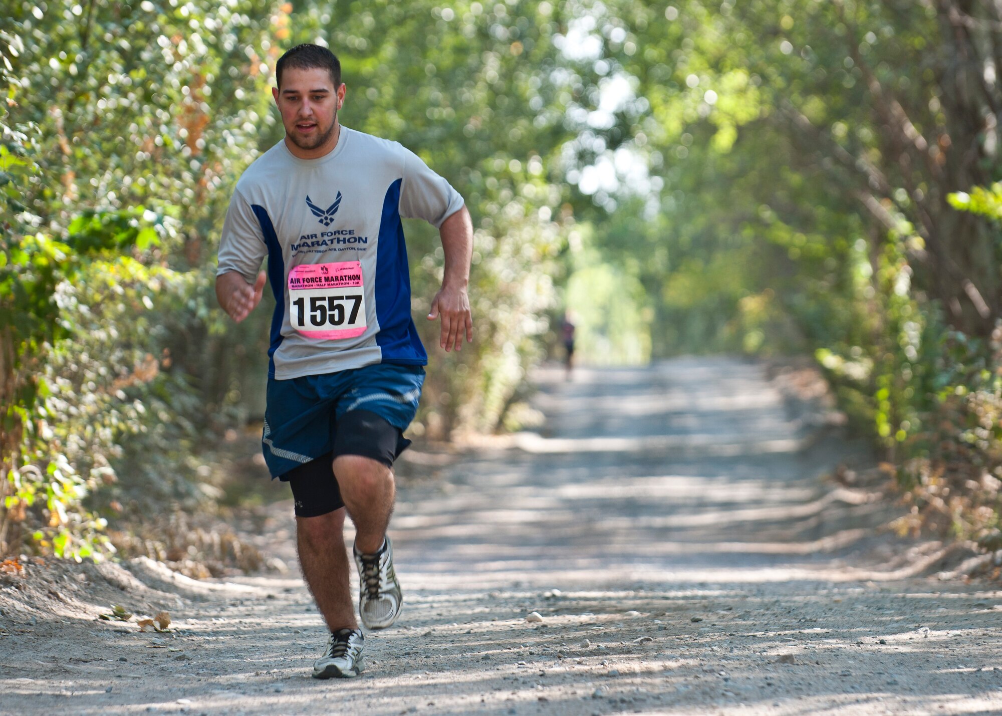 Airman 1st Class Francis Sparks runs down the home stretch at the Transit Center at Manas, Kyrgyzstan, Sept. 15, 2012. More than 150 participants from the Transit Center and Manas International Airport ran in the 10k, half- and full marathon races. Sparks is a 376th Air Expeditionary Wing cashier and customer service technician deployed from McConnell Air Force Base, Kan. (U.S. Air Force photo/Senior Airman Brett Clashman)