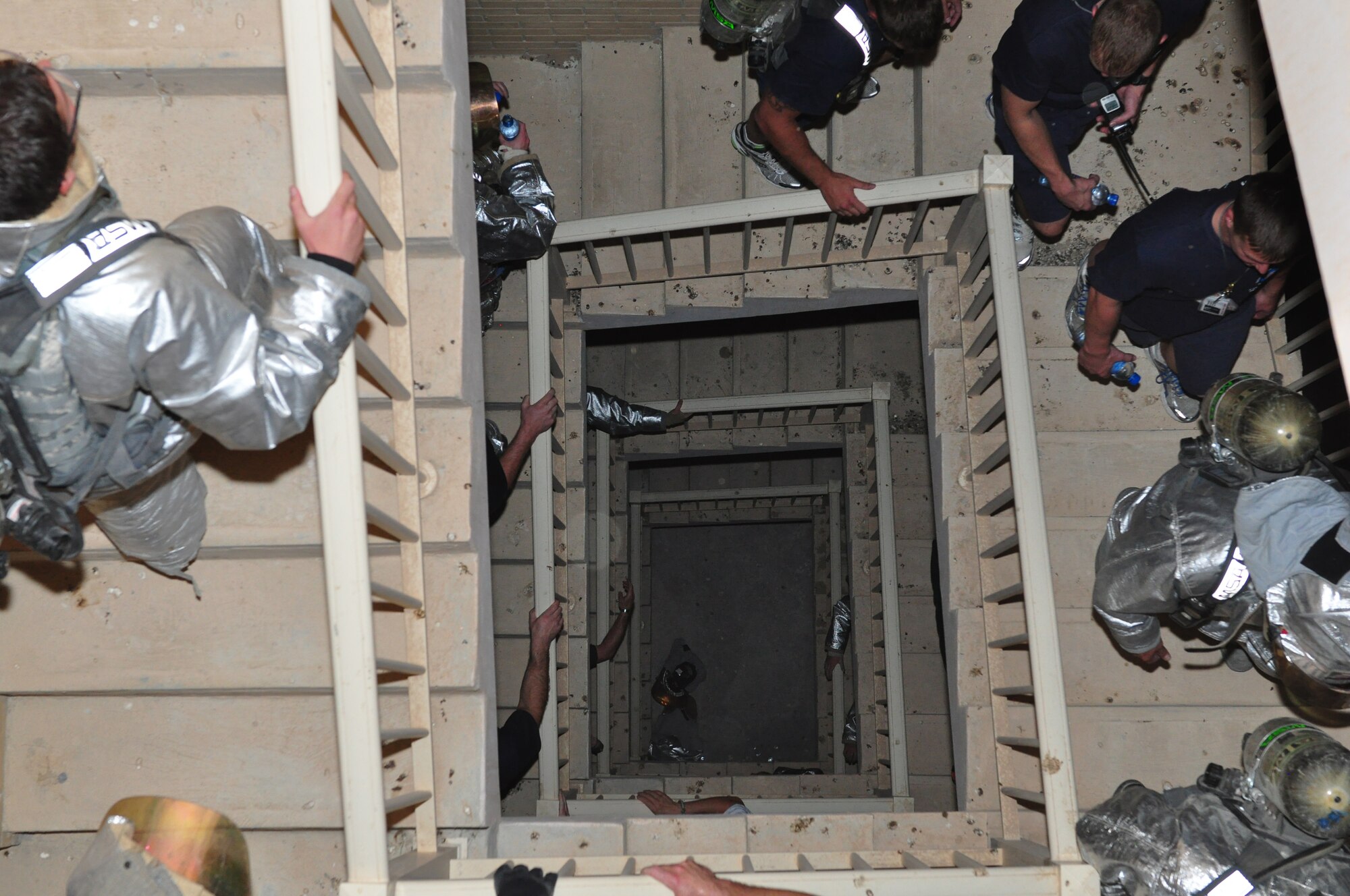 SOUTHWEST ASIA – Members of the 386th Expeditionary Civil Engineer Squadron fire department, climb the control tower in remembrance of the emergency service members who died on Sept. 11, 2001. New York fire fighters climbed 110 stories of the World Trade Center towers to rescue those inside. To commemorate this event, Rock Fire climbed the five-story tower 22 times.(U.S. Air Force photo/Master Sgt. John Duffy)