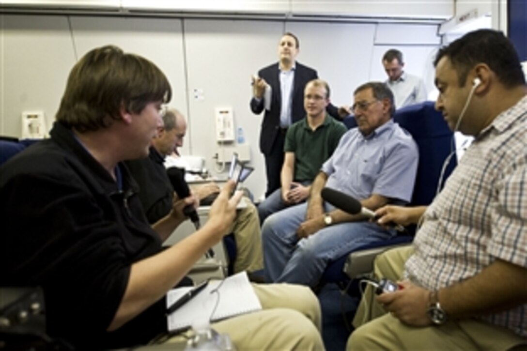 U.S. Defense Secretary Leon E. Panetta gives an in-flight press briefing while flying to Tokyo, Sept. 15, 2012. Panetta is on an eight-day trip to meet with defense counterparts in Japan, China and New Zealand. 