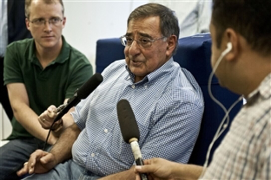U.S. Defense Secretary Leon E. Panetta gives an in-flight press briefing while flying to Tokyo, Sept. 15, 2012. Panetta is on an eight-day trip to meet with defense counterparts in Japan, China and New Zealand. 