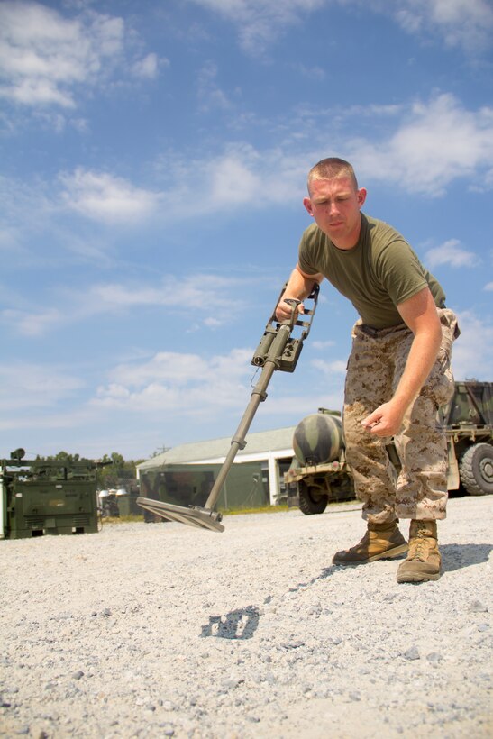 Lance Cpl. Hunter Eden, heavy equipment operator from Palm Bay, Fla., with Combat Logistics Battalion (CLB) 26 practices minesweeping, part of a training plan to teach Marines the basics of other occupational specialties at Fort Pickett, Va., Sept 15, 2012. This training is part of the 26th Marine Expeditionary Unit?s pre-deployment training program. CLB-26 is one of the three reinforcements of 26th MEU, which is slated to deploy in 2013.