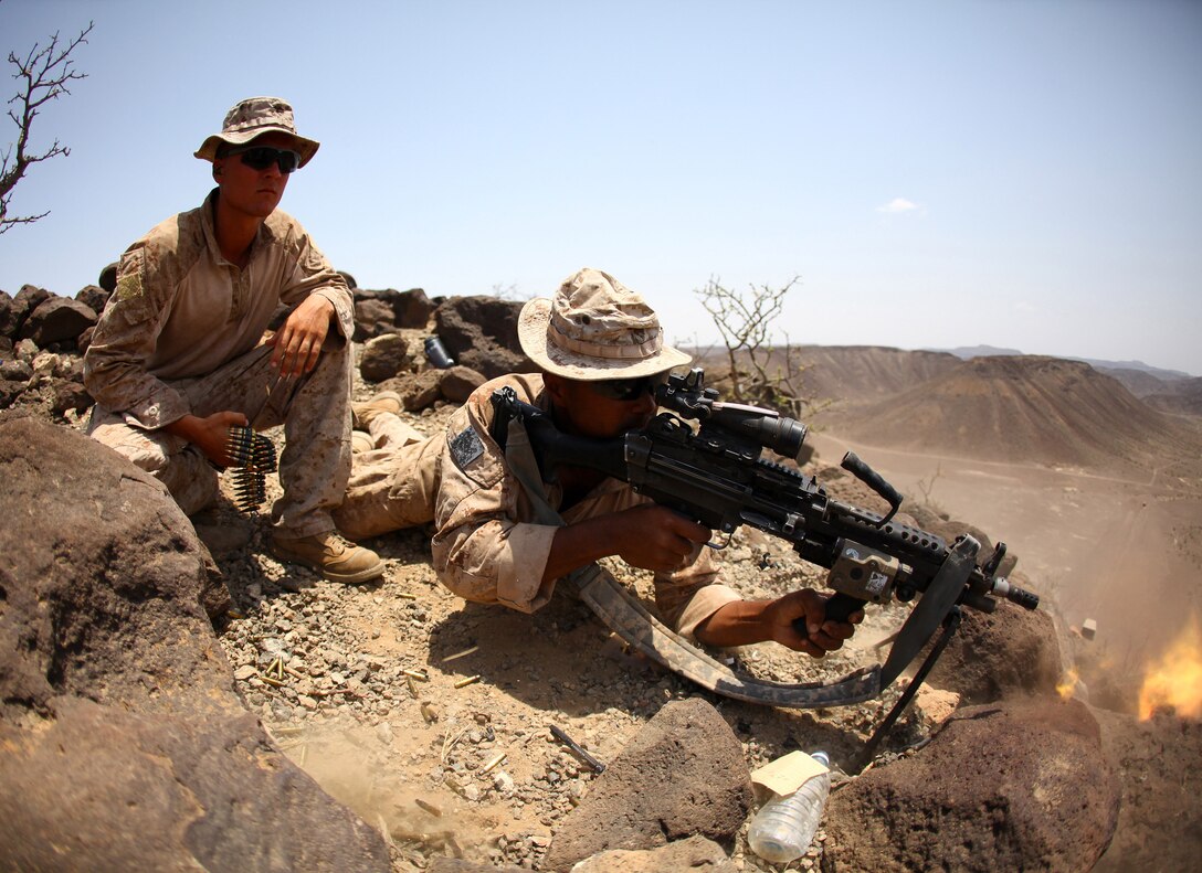 Lance Cpl. Martin Williams, an automatic rifleman with 1st Platoon, Company B, Battalion Landing Team, 1st Battalion, 2nd Marine Regiment, 24th Marine Expeditionary Unit, fires an M-249 Squad Automatic Weapon during high-angle marksmanship training as part of a three-week training package in Djibouti, Sep. 15. The training was focused on the application of infantry skills in rugged mountain terrain. The 24th MEU is deployed with the Iwo Jima Amphibious Ready Group as a theater reserve and crisis response force throughout U.S. Central Command and the Navy's 5th Fleet area of responsibility.