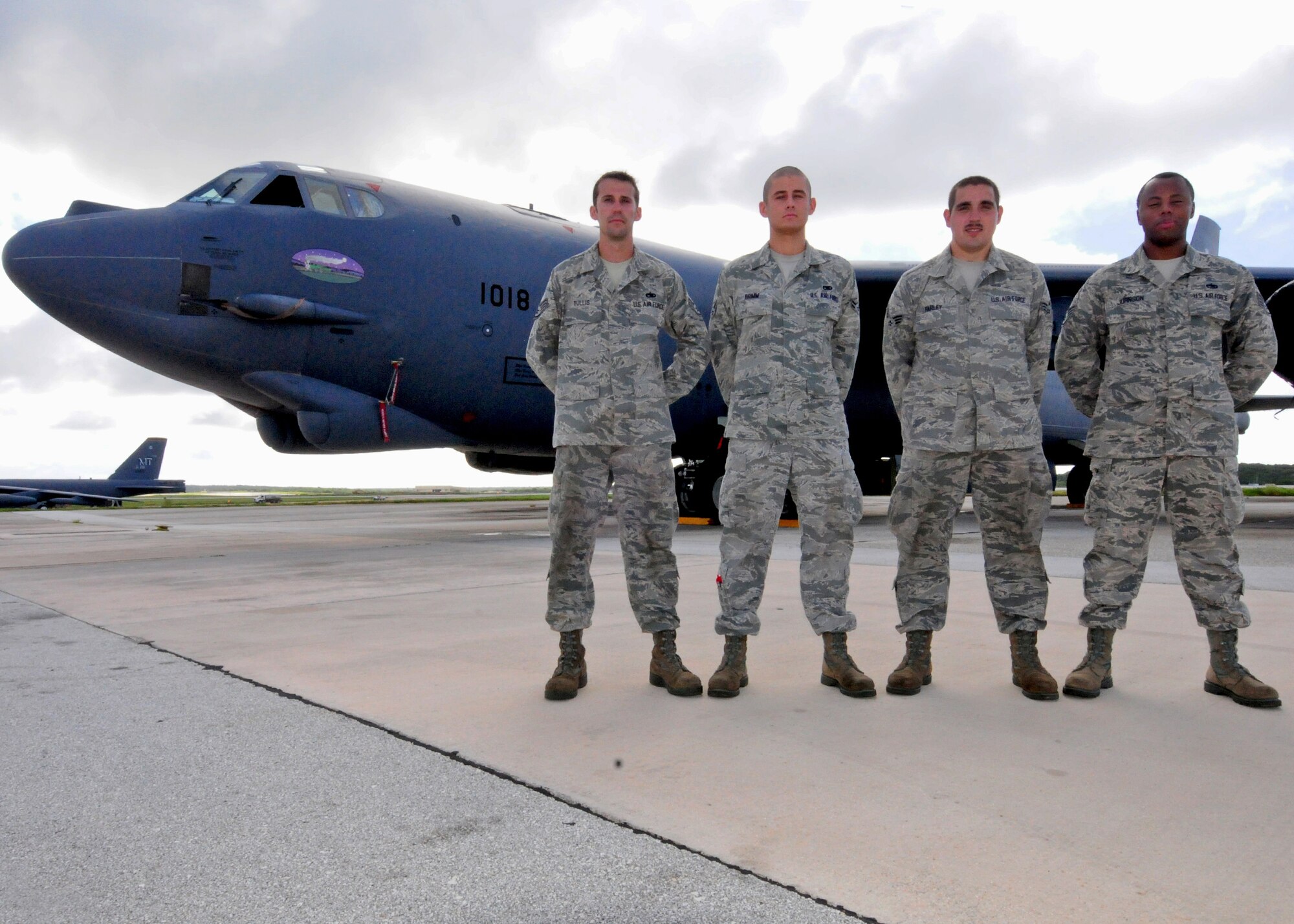 ANDERSEN AIR FORCE BASE, Guam  -- "Nine-O-Nine" award winners Staff Sgt. Nicholas Tullis, Airman 1st Class Bruce Brimm, Senior Airman Cody Farley and Staff Sgt. Oliver Johnson, 36th Expeditionary Aircraft Maintenance Squadron crew chiefs, stand in front of B-52 Stratofortress A1018 on the flightline here, July 24. Under the aircrew’s care, B-52 A1018 accomplished 20 consecutive sorties without a maintenance abort. (U.S. Air Force photo by Senior Airman Benjamin Wiseman/Released)