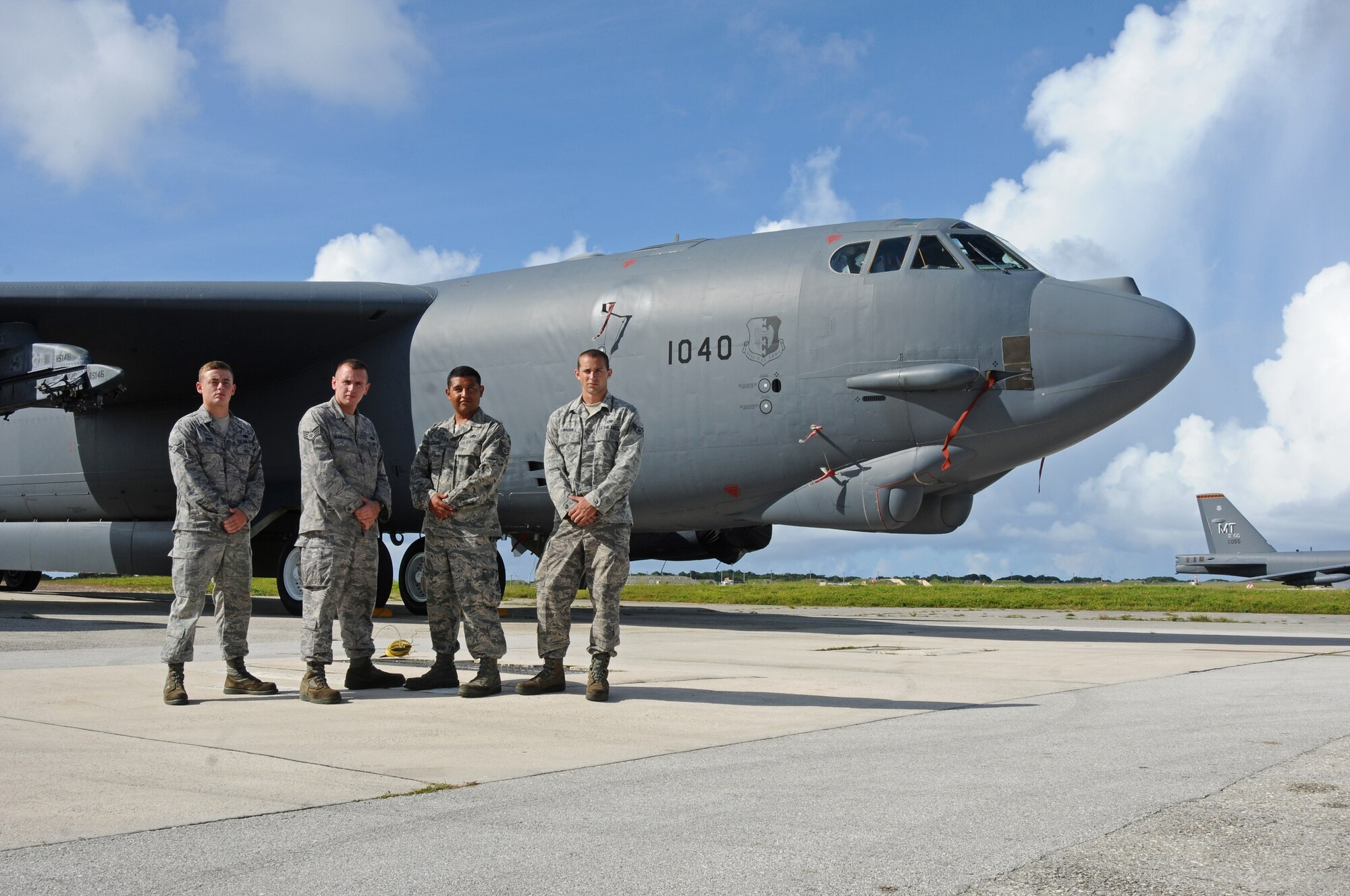 ANDERSEN AIR FORCE BASE, Guam  -- "Nine-O-Nine" award winners Airman 1st Class Jordon Dyer, Staff Sgt. Timothy Beamesderfer, Staff Sgt. Jim Alcozer and Airman 1st Class Michael Lawhorn, 36th Expeditionary Aircraft Maintenance Squadron crew chiefs, stand in front of B-52 Stratofortress A1040 on the flightline here, July 24. Under the aircrew’s care, B-52 A1040 accomplished 20 consecutive sorties without a maintenance abort. (U.S. Air Force photo by Senior Airman Carlin Leslie/Released)

