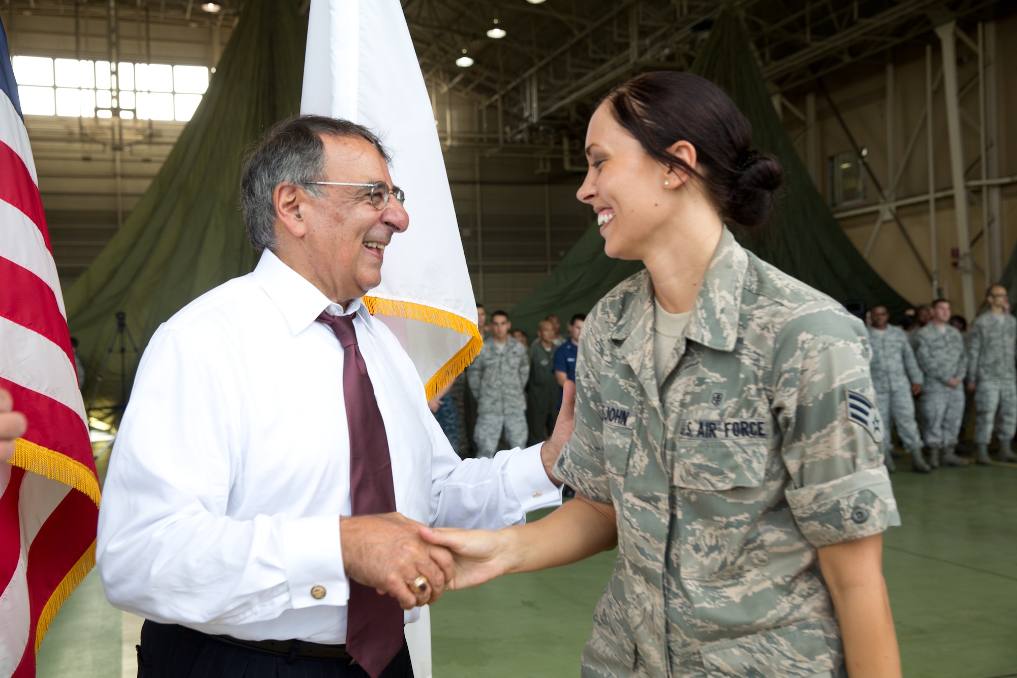 YOKOTA AIR BASE, Japan -- Senior Airman Sarah Littlejohn, 374th Airlift Wing, receives a coin from Secretary of Defense Leon E. Panetta at Yokota Air Base, Japan, Sept. 17, 2012. Panetta is slated to travel to China and New Zealand following his visit at Yokota. (U.S. Air Force photo by Osakabe Yasuo)