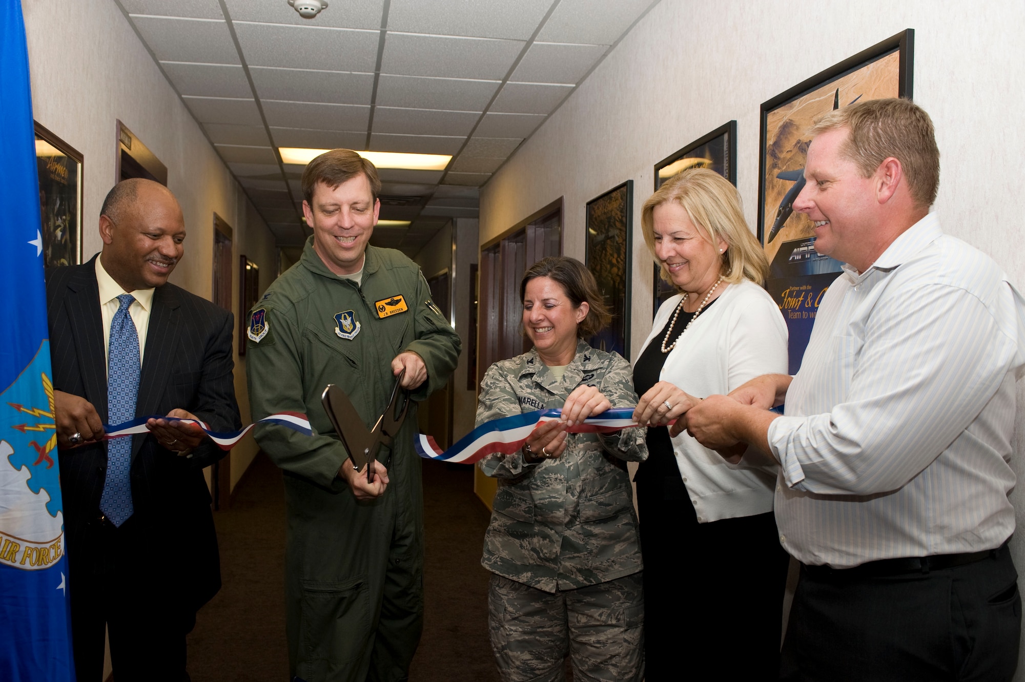 (Left to Right) Mr. Dwight Jones, Clark County School District superintendent, Col. John Breeden, 926th Group commander, Col. Carol Yannarella, 99th Air Base Wing vice commander, Ms. Barbara Koscak, STARBASE founder, and Mr. Myles Judd, STARBASE NELLIS director, cut the ribbon signifying the official opening of the STARBASE NELLIS academy during a ceremony here Sept. 12. (U.S. Air Force photo/Airman First Class Christopher Tam)