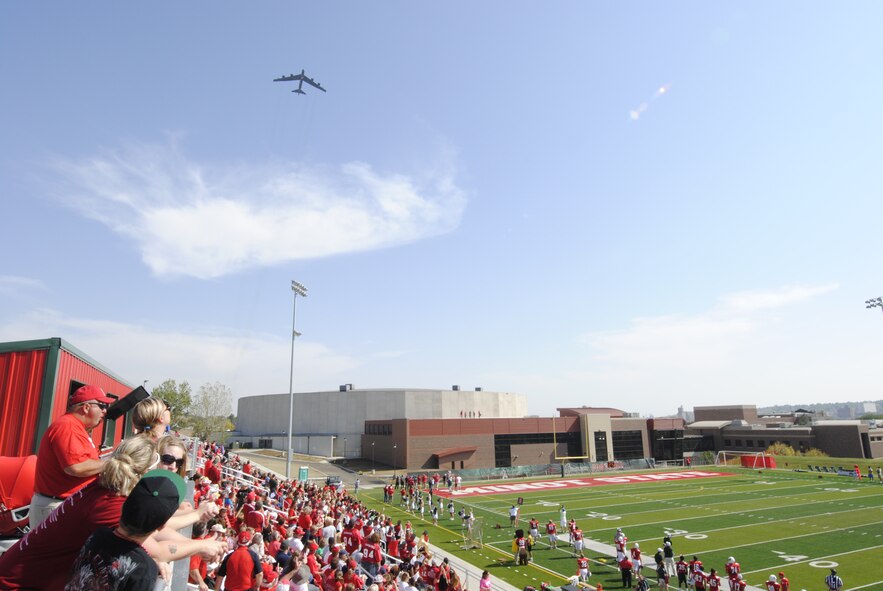 MINOT, N.D. -- A B-52H Stratofortress from Minot Air Force Base conducts a flyover at Minot State University's Herb Parker Stadium during a season football game, Sept. 15. Flyovers are an important part of community engagement for the Air Force and have been a long standing tradition during seasonal sporting events around the country. (U.S. Air Force photo/2nd Lt. Jose Davis)