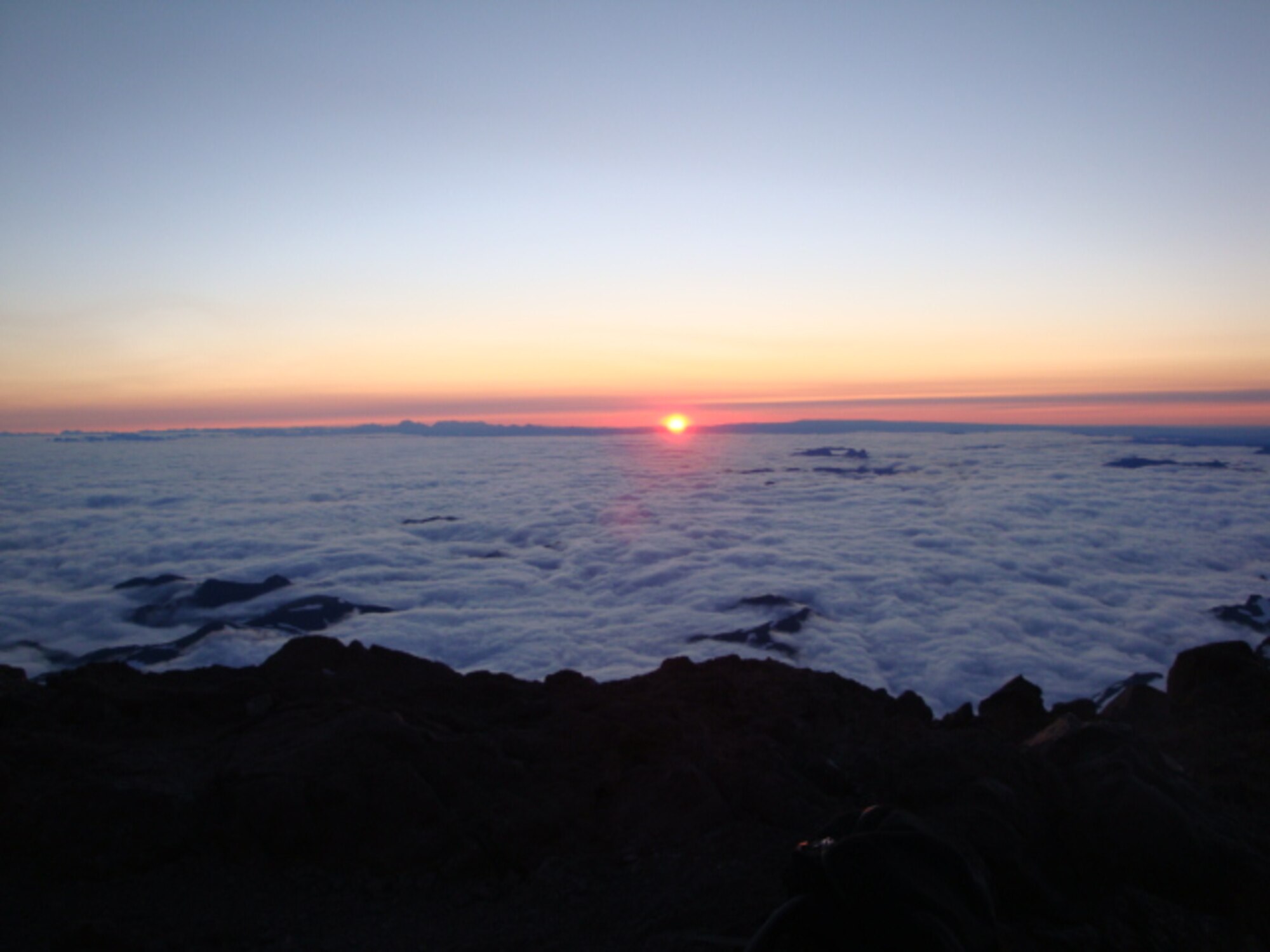 The view from the top of Disappointment Cleaver as seen by Capt. Rebecca Bissette, 618th Air and Space Operations Center (Tanker Airlift Control Center) executive officer, during her rise to Mount Rainier. Bissette climbs mountains to challenge herself and to see the vista. (Courtesy photo) 