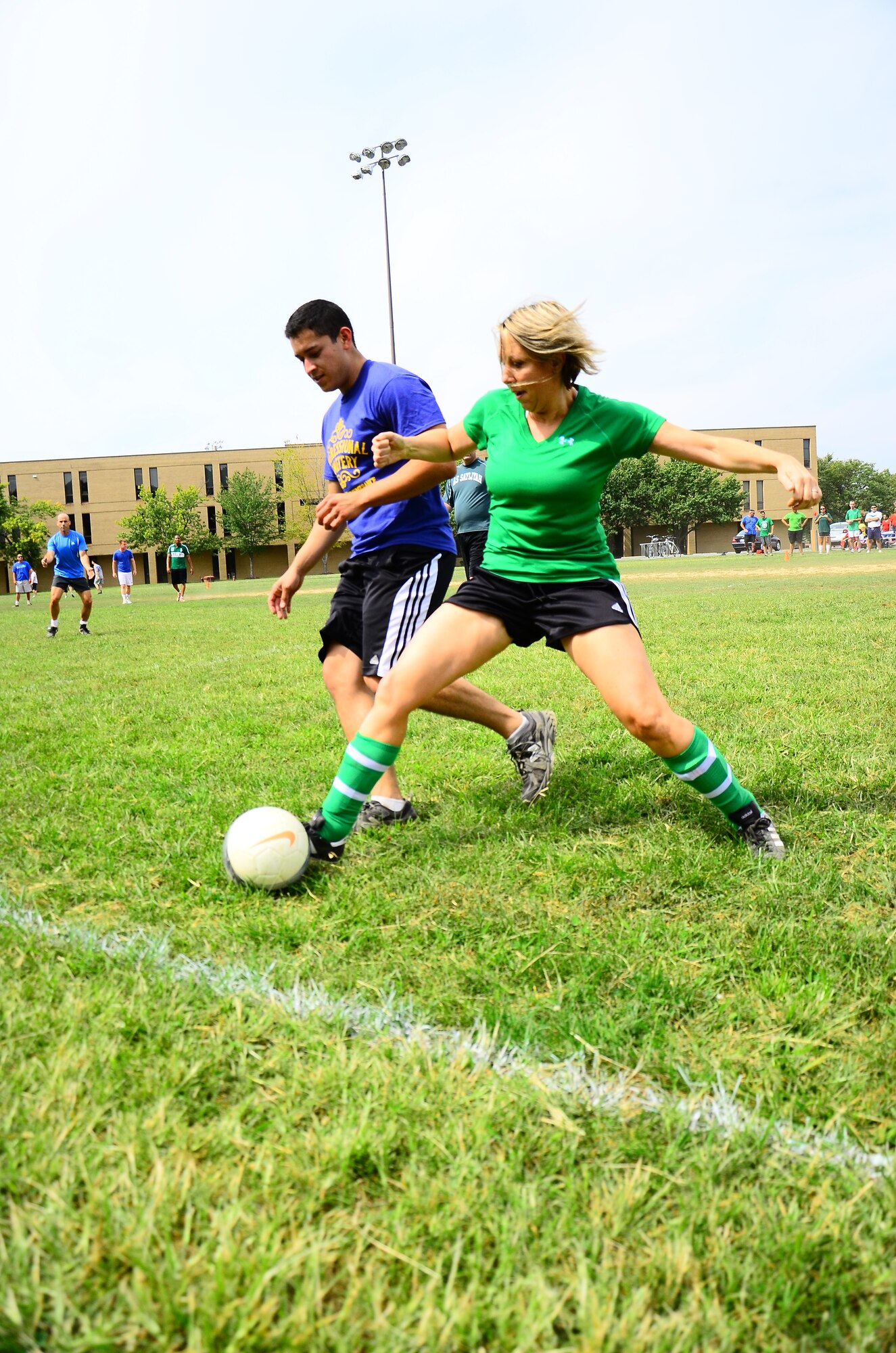 Deputy Commander of the 459th Mission Support Group, Lt. Col. Jeannette Clark, steals the ball from a member of the 459th Maintenance Group during a game of soccer at the Sports and Family Day event near the West Fitness Center, Sept.16, 2012. This was the Fourth Annual 459 Air Refueling Wing Family Day and the first time incorporating sports into the event. The 459th Maintenance Group took home the trophy. (U.S. Air Force photo/ Senior Airman Chris Friday)