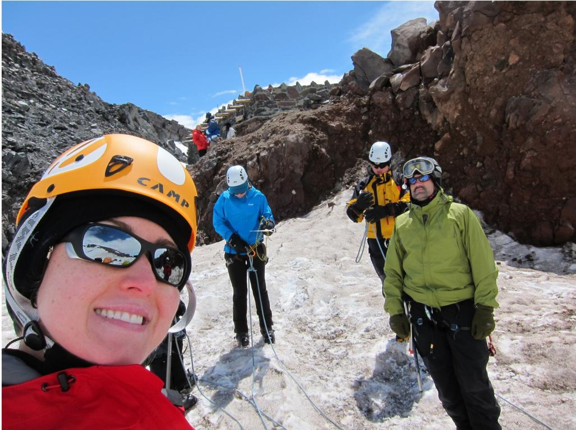 Capt. Rebecca Bissette, 618th Air and Space Operations Center (Tanker Airlift Control Center) executive officer, and a group of climbers conduct crevasse rescue training prior to climbing Mount Rainier. It was fortunate that the group had the chance to practice since they encountered an accident during the descent. (Courtesy photo) 