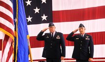 Lt. Col. John G. Poor (left) and  Lt. Col. Robert R. Tofil (right) render a salute during the playing of the National Anthem during the Operations Support Squadron's change of command ceremony, Sept. 8. (U.S. Air Force photo/ Staff Sgt. Lou Burton, 482nd Fighter Wing Public Affairs.)