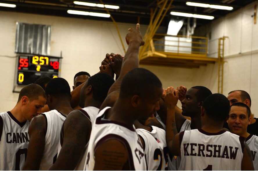 The men's varsity basketball team comes together to yell a team chant during the basketball game in the Ftness Center at Cannon Air Force Base, N.M., Sept. 15, 2012. Cannon's varsity basketball team hosted a double header versus Holloman Air Force Base, N.M. (U.S. Air Force photo/Airman 1st Class Eboni Reece)