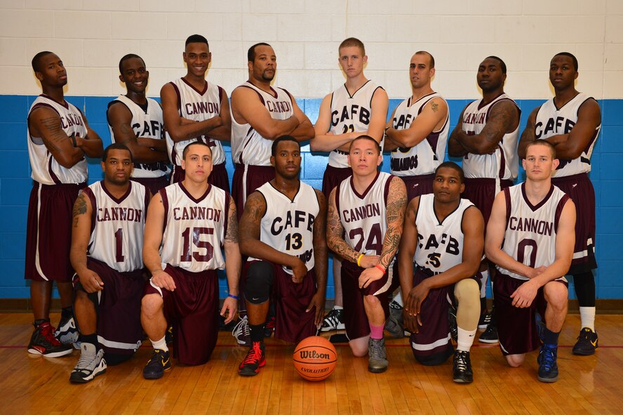 The varsity basketball team poses for a pre-game photo at the Fitness Center at Cannon Air Force Base, N.M., Sept. 15, 2012. Cannon's varsity basketball team hosted a double header versus Holloman Air Force Base, N.M. (U.S. Air Force photo/Airman 1st Class Eboni Reece)