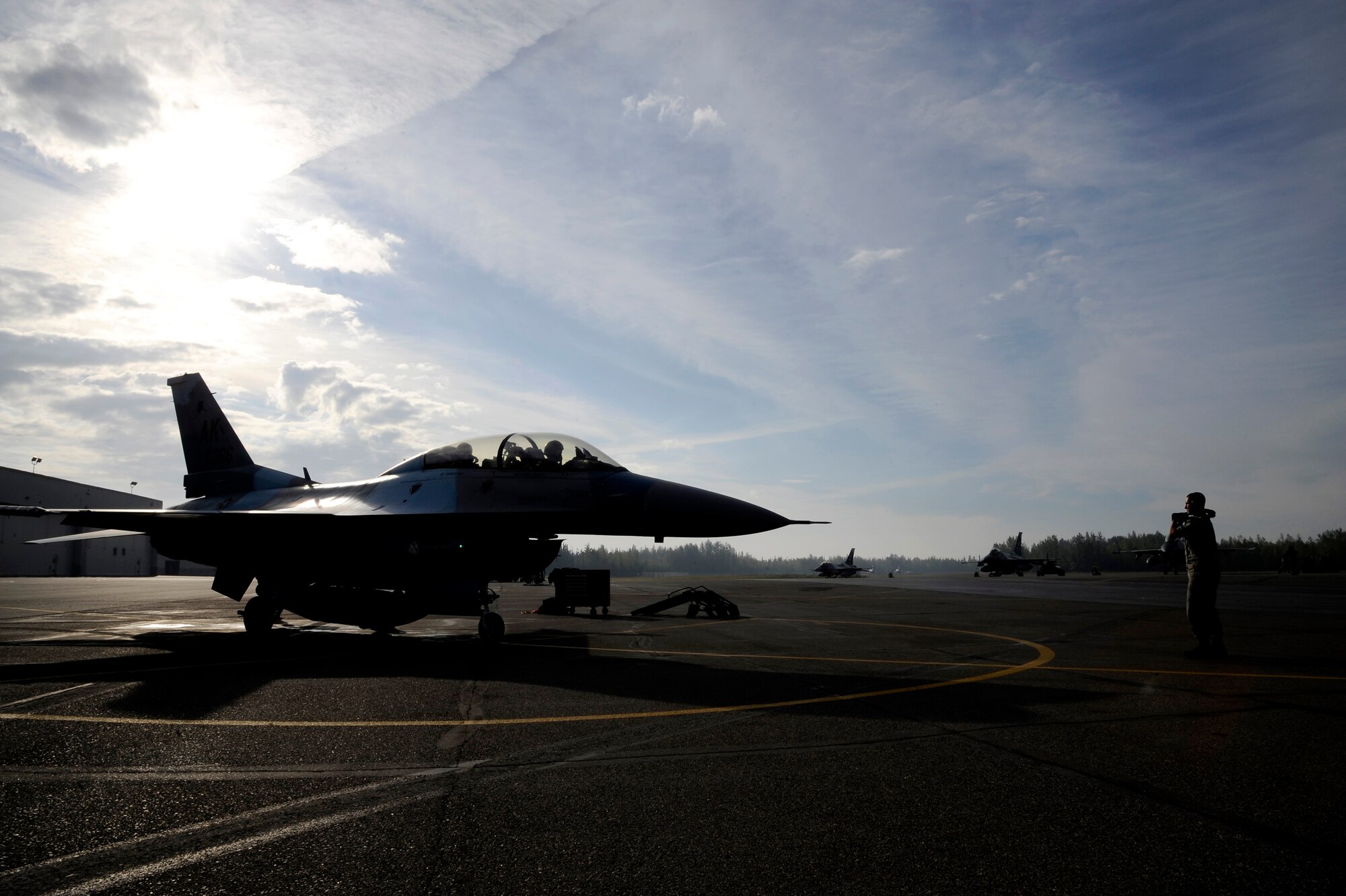 An 18th Aggressor Squadron F-16 Fighting Falcon carrying U.S. Air Force Gen. “Hawk” Carlisle, Pacific Air Forces commander, prepares to take off for a familiarization flight Aug. 24, 2012, Eielson Air Force Base, Alaska. Carlisle went on the flight to witness first-hand the capabilities of 18th AGRS and the air space of the Joint Pacific Alaska Range Complex. (U.S. Air Force photo/Staff Sgt. Jim Araos)