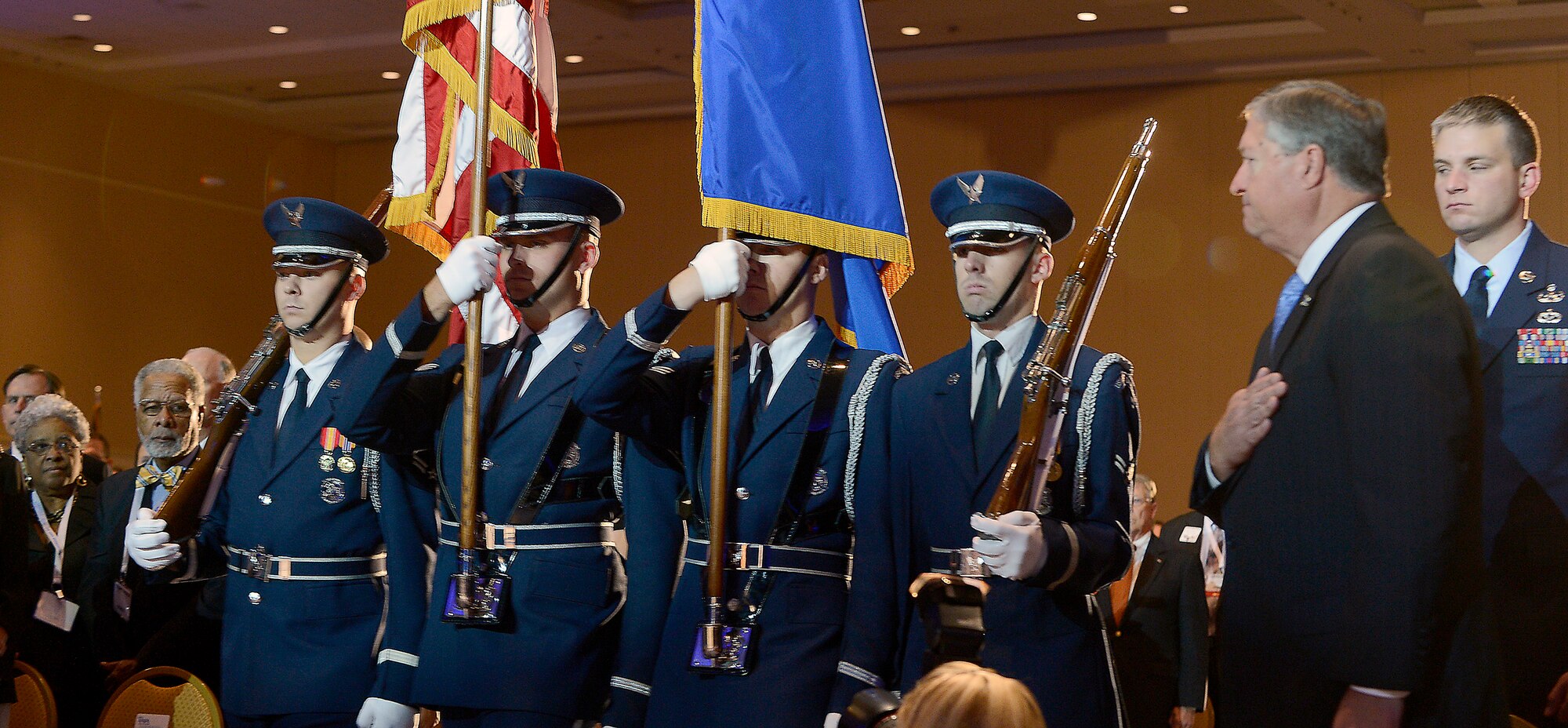 Honor guard members prepare to post the colors as Secretary of the Air Force Michael Donley looks on during the opening ceremony of the Air Force Association's Air and Space Conference and Technology Exposition in Washington, D.C., Sept. 17, 2012. (U.S. Air Force photo/Scott M. Ash)