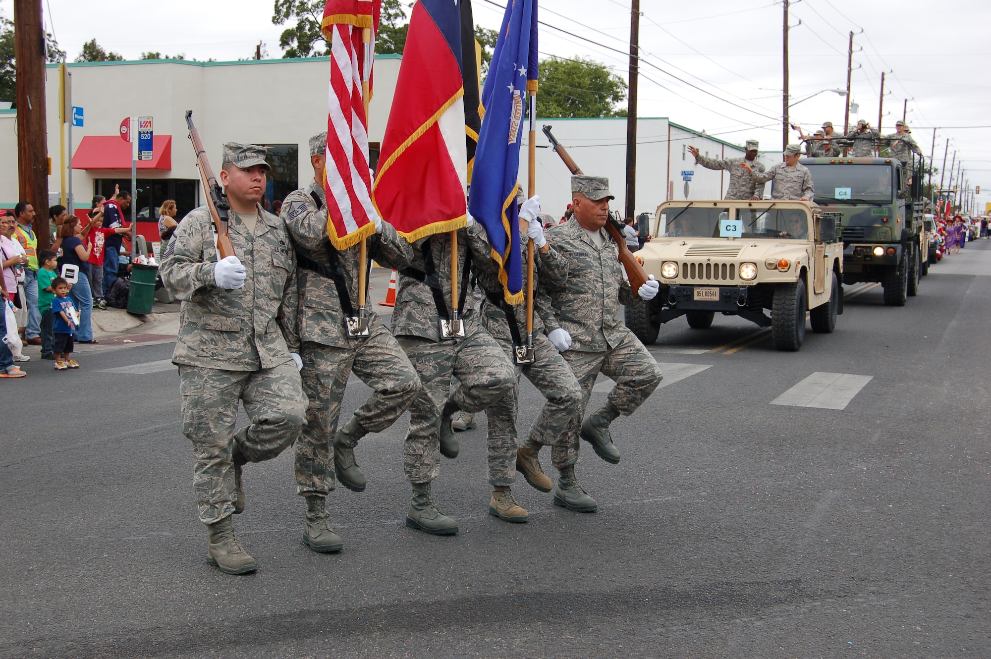 The 433rd Airlift Wing's Honor Guard Ceremonial Unit rounds a corner onto Guadalupe Street as they march in the 31st Annual Dieciseis parade, sponsored by the Avenida Guadalupe Asociacion in San Antonio, Texas on Sept. 15, 2012.    "Dieciseis," or Sept. 16, commemorates Mexico's declared independence from Spanish rule in 1810.  The 433rd AW, or "Alamo Wing," is an Air Force Reserve unit located at Joint Base San Antonio-Lackland, Texas. (U.S. Air Force Photo/Elsa Martinez)