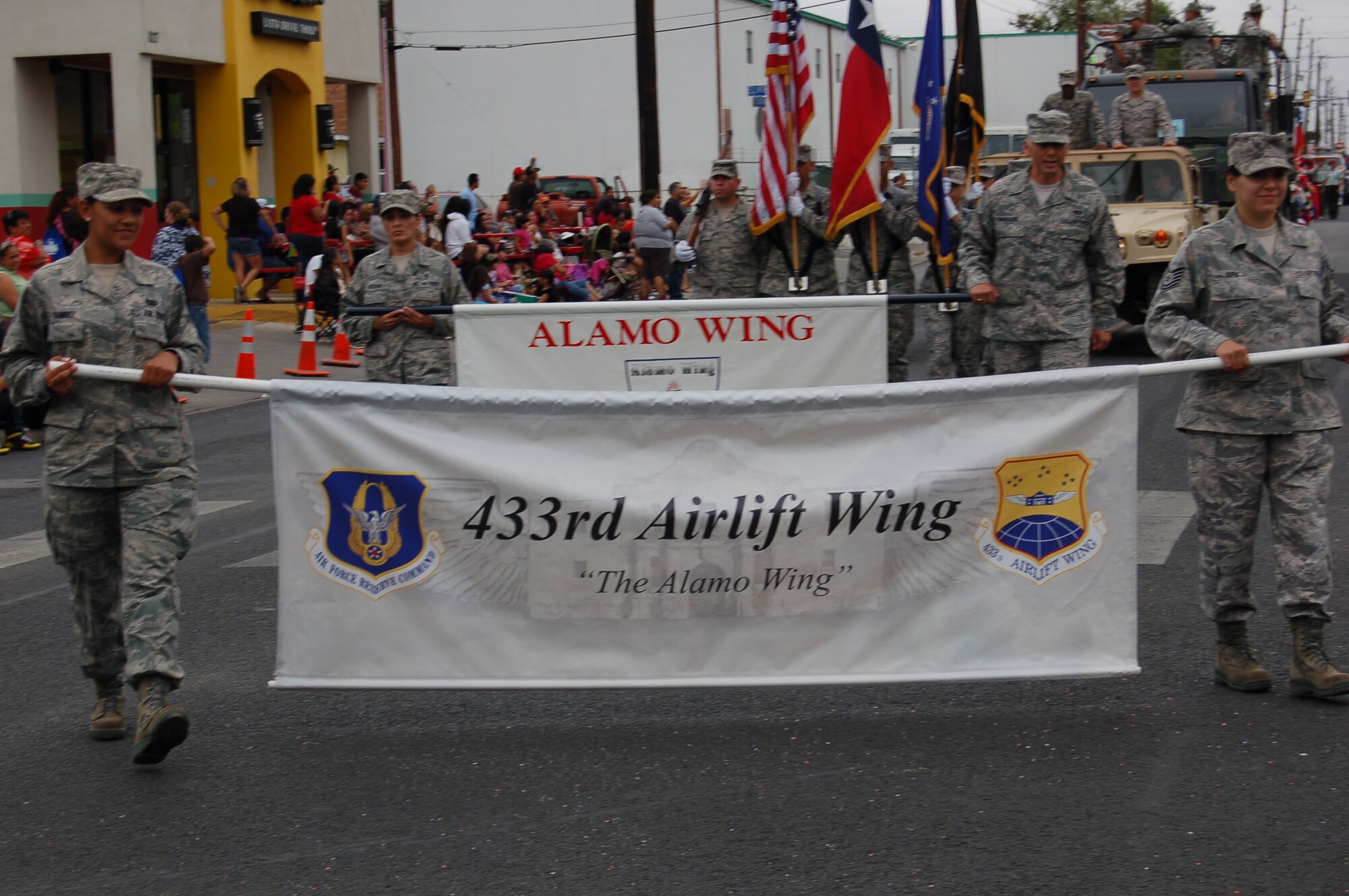 433rd Airlift Wing Airmen participate in the 31st Annual Dieciseis parade, sponsored by the Avenida Guadalupe Asociacion in San Antonio, Texas on Sept. 15, 2012.   "Dieciseis," or Sept. 16, commemorates Mexico's declared independence from Spanish rule in 1810.  The 433rd AW, or "Alamo Wing," is an Air Force Reserve unit located at Joint Base San Antonio-Lackland, Texas. (U.S. Air Force Photo/Elsa Martinez)