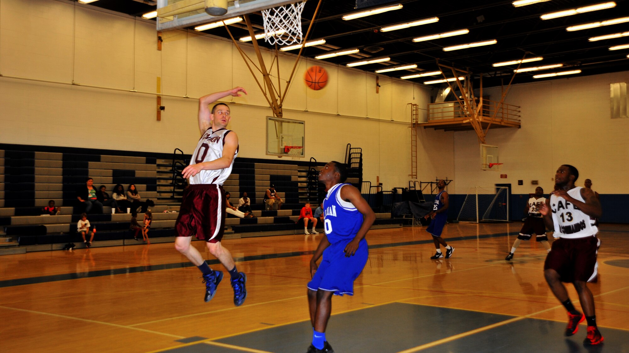 U.S. Staff Sgt. Adam Stevenson, 27th Logistics Readiness Squadron unit Fitness Program manager and Cannon Air Force Base, N.M., men’s varsity basketball shooting guard, hooks a pass to his teammate during a match up against varsity members from Holloman Air Force Base, N.M., at the base Fitness Center, Sept. 15, 2012. Air Commandos ended the opening game of the double feature on a high note, with a score of 79 to 71, but later tasted defeat, closing out the final game with a 12-point deficit at 54 to 66. (U.S. Air Force photo/Senior Airman Whitney Tucker)