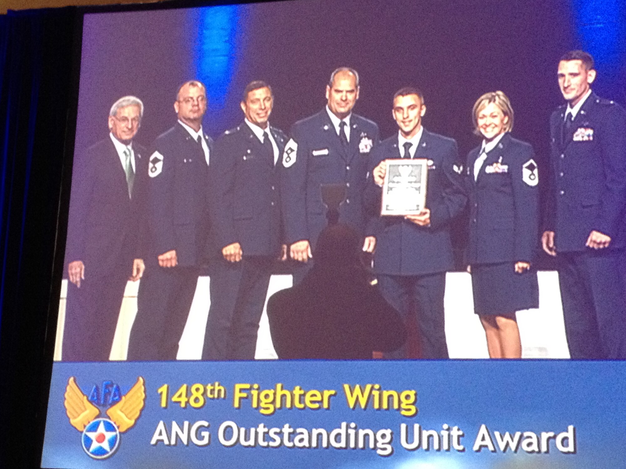 S. Sandford Schlitt, Chairman of the Board – Air Force Association presents the 2012 Air Force Association Outstanding Air National Guard Flying Unit Award to:  Sr. Master Sgt. Matt Wolff, Col. Frank Stokes, Chief Master Sgt. Mark Rukavina, Airman First Class Peter Erdahl, Master Sgt. Cynthia Wahl, and Lt. Will Carr at the 2012 Air Force Association Air and Space Conference in National Harbor, MD.