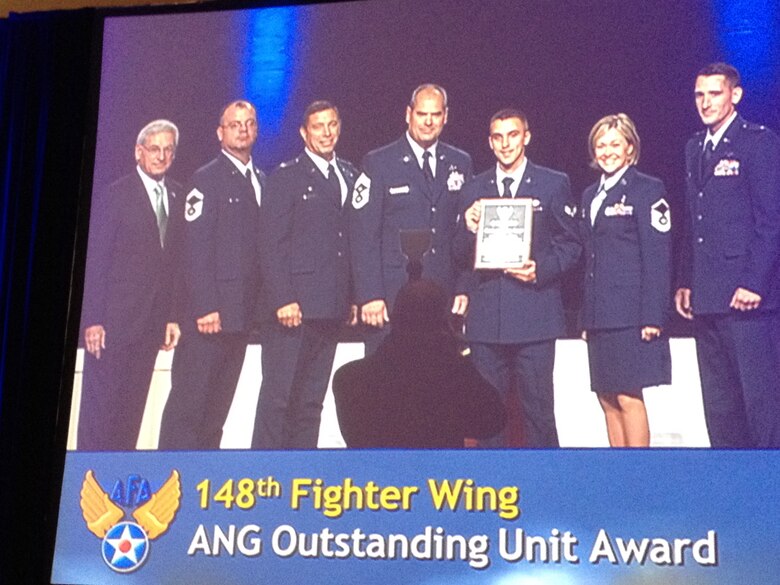 S. Sandford Schlitt, Chairman of the Board – Air Force Association presents the 2012 Air Force Association Outstanding Air National Guard Flying Unit Award to:  Sr. Master Sgt. Matt Wolff, Col. Frank Stokes, Chief Master Sgt. Mark Rukavina, Airman First Class Peter Erdahl, Master Sgt. Cynthia Wahl, and Lt. Will Carr at the 2012 Air Force Association Air and Space Conference in National Harbor, MD.