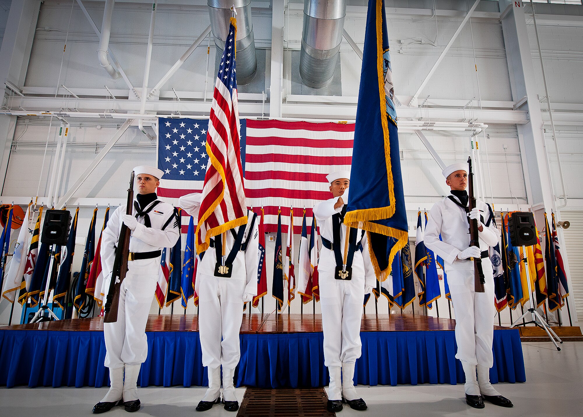Naval Air Station Pensacola’s color guard presents the colors at the beginning of a chief petty officer pinning ceremony held by the Navy's F-35 Lightning II squadron, VFA-101, Sept. 14 at Eglin Air Force Base, Fla. The ceremony formally marks the transition from E-6 to chief.  There were four Sailors who pinned on the new rank. A Marine and a Soldier were also pinned as honorary chiefs.  (U.S. Air Force photo/Samuel King Jr.)