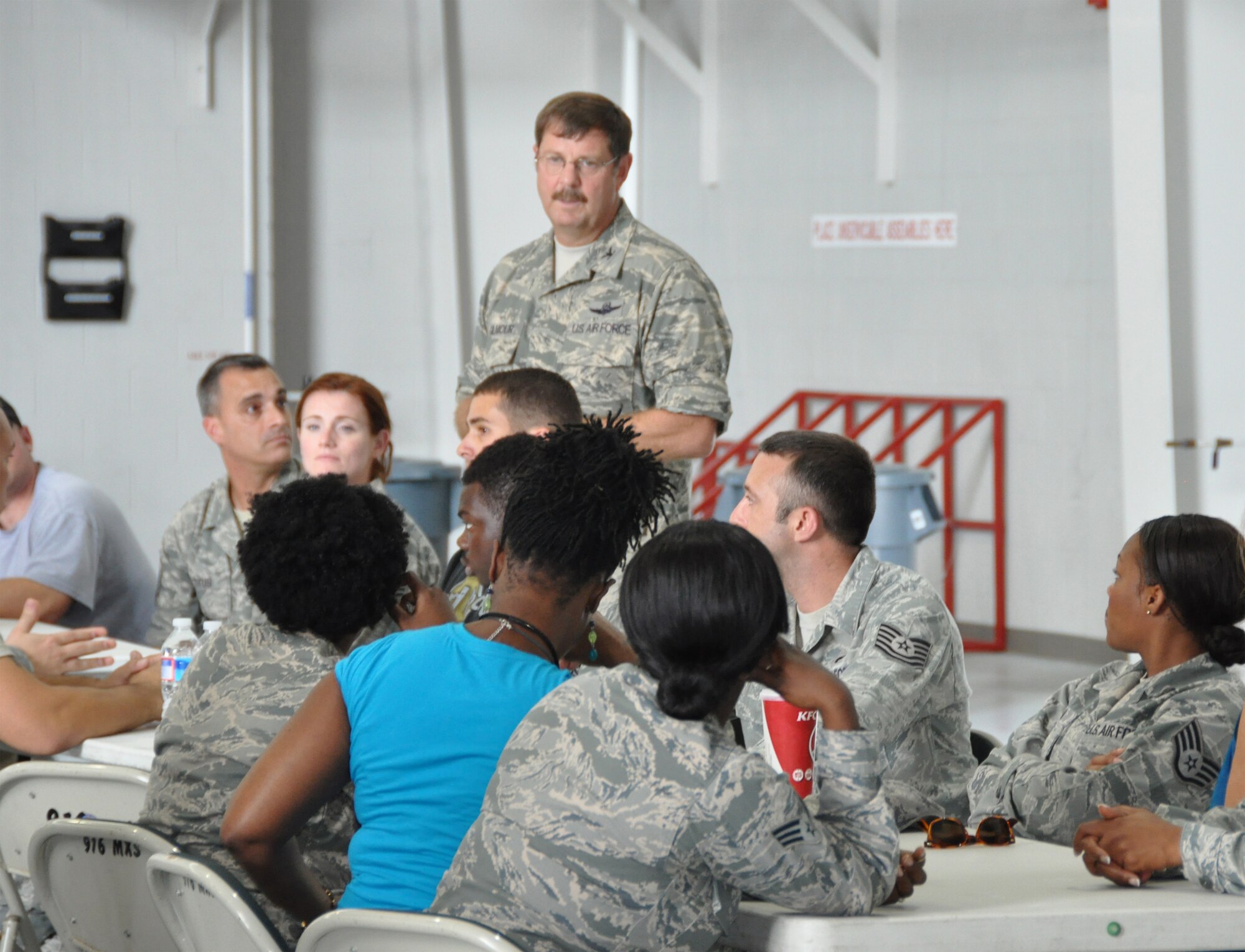 Col. Gregory S. Gilmour, new wing commander for the 916th Air Refueling Wing, talks to a group of maintainers on Friday, Sep. 14, 2012. Gilmour's change of command ceremony takes place on Sep. 23, 2012. (USAF photo by Ms. Donna Lea, 916ARW/PA)