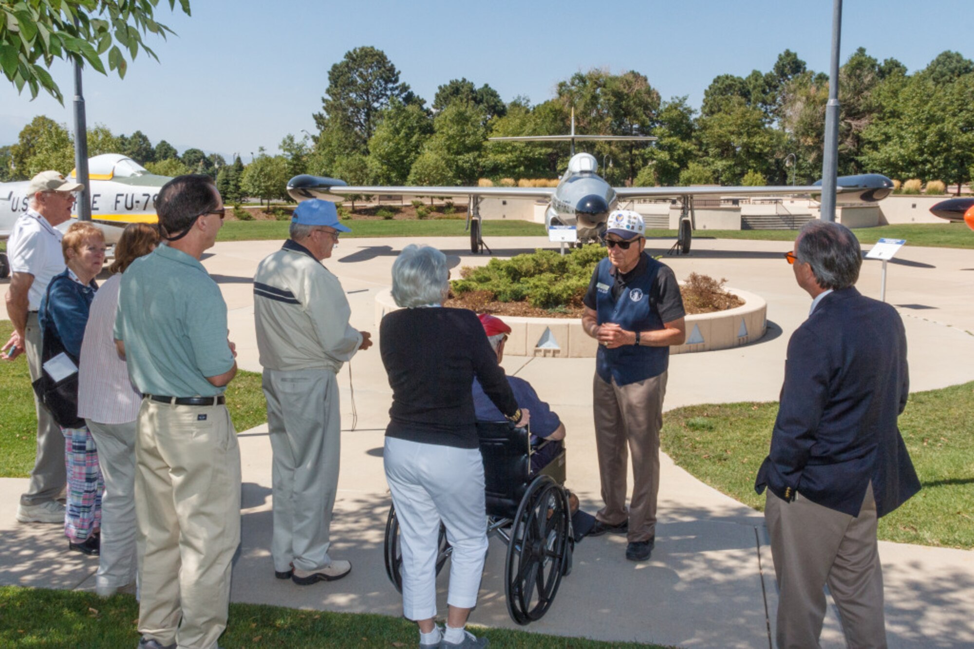 PETERSON AIR FORCE BASE, Colo. – Peterson Air and Space Museum docent Gus Freyer shows visitors from the 55th Wing Association reunion around the airpark Sept. 8, 2012. The 55th Wing Association hosted a reunion this year in Colorado Springs and drew members representing more than 20 states, including pilots, mechanics, navigators, Airmen and their family members. The 55th Wing, the Fightin’ Fifty-Fifth, activated Jan. 15, 1941, at Hamilton Field, Calif. The wing was the first P-38 unit in the European theater and primarily a reconnaissance unit from the mid 1940s until the late 1990s. Currently the 55th Wing’s missions execute more diverse flying operations. The 55th Wing is now located at Offutt Air Force Base, Neb., and is Air Combat Command’s largest wing. (U.S. Air Force photo/Bruce Long)