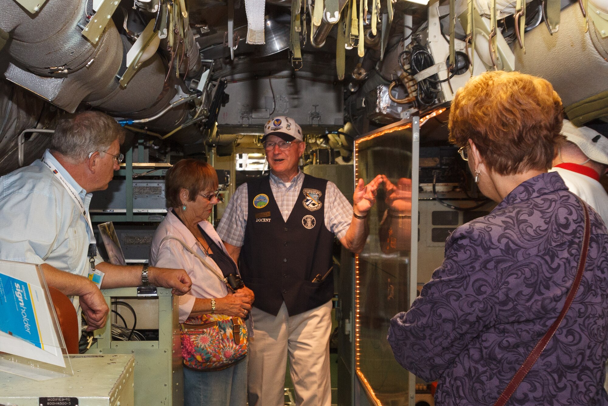 PETERSON AIR FORCE BASE, Colo. – Peterson Air and Space Museum volunteer docent Dave Austin gives a tour to visiting members of the 55th Wing Association inside the museum’s EC-121 “Warning Star” display aircraft Sept. 8, 2012. The 55th Wing Association hosted a reunion this year in Colorado Springs and drew members representing more than 20 states, including pilots, mechanics, navigators, Airmen and their family members. The 55th Wing, the Fightin’ Fifty-Fifth, activated Jan. 15, 1941, at Hamilton Field, Calif. The wing was the first P-38 unit in the European theater and primarily a reconnaissance unit from the mid 1940s until the late 1990s. Currently the 55th Wing’s missions execute more diverse flying operations. The 55th Wing is now located at Offutt Air Force Base, Neb., and is Air Combat Command’s largest wing. (U.S. Air Force photo/Bruce Long)