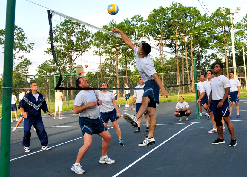 A 919th Maintenance Group Airman spikes the ball in a volleyball match at the 919th MXG Olympics Sept. 8, 2012 at Duke Field, Fla.  The event featured 12 different team events aimed at boosting unit morale and team building.  (U.S. Air Force photo/Tech. Sgt. Jasmin Taylor)