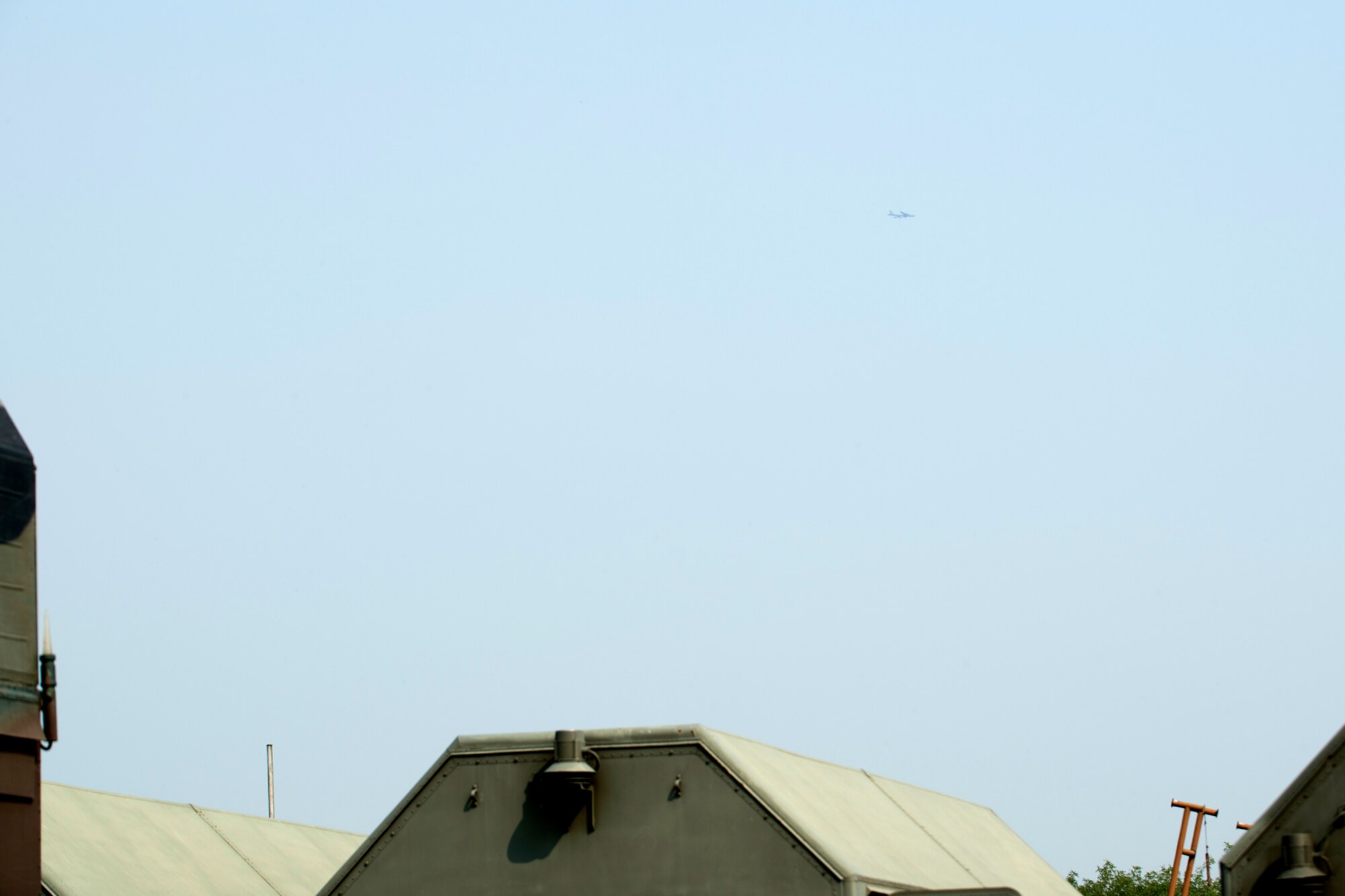 A 93rd Bomb Squadron B-52H Stratofortress can be seen in the distant sky on the outskirts of a Slovak Air Force surface-to-air missile (SAM) base near Nitra, Slovakia, Sept. 3, 2012. The B-52 participated in a joint training exercise which tested the aircraft's defense capabilities against SA-10 and SA-6 SAMs. (U.S. Air Force photo by Master Sgt. Greg Steele/Released)