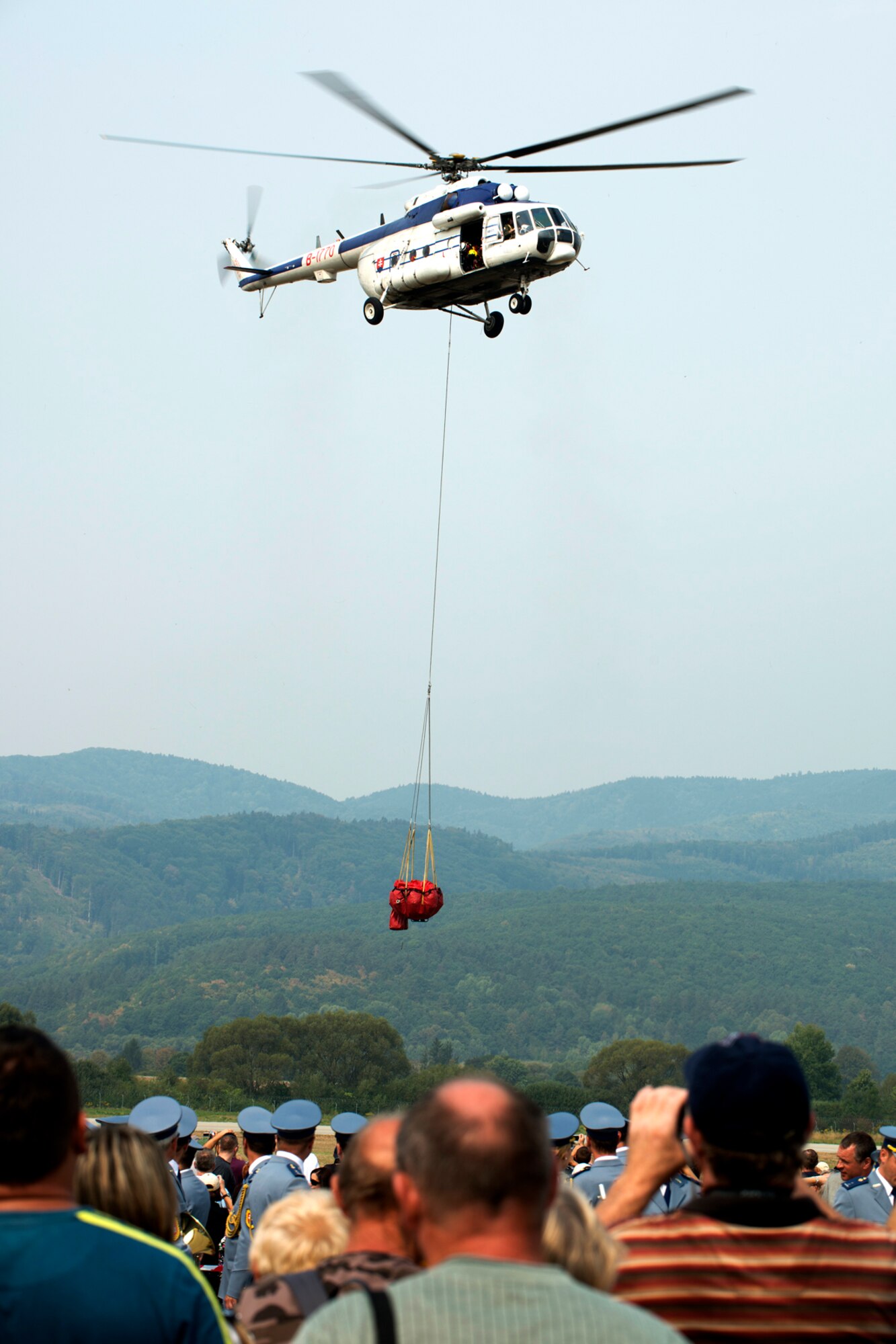 Spectators watch an aerial demonstration during the Slovak International Air Fest, Sept. 2, 2012, Sliac, Slovakia. Approximately 115,000 people attended the two-day air show, which included a display of a 307th Bomb Wing B-52H Stratofortress. (U.S. Air Force photo by Master Sgt. Greg Steele/Released)