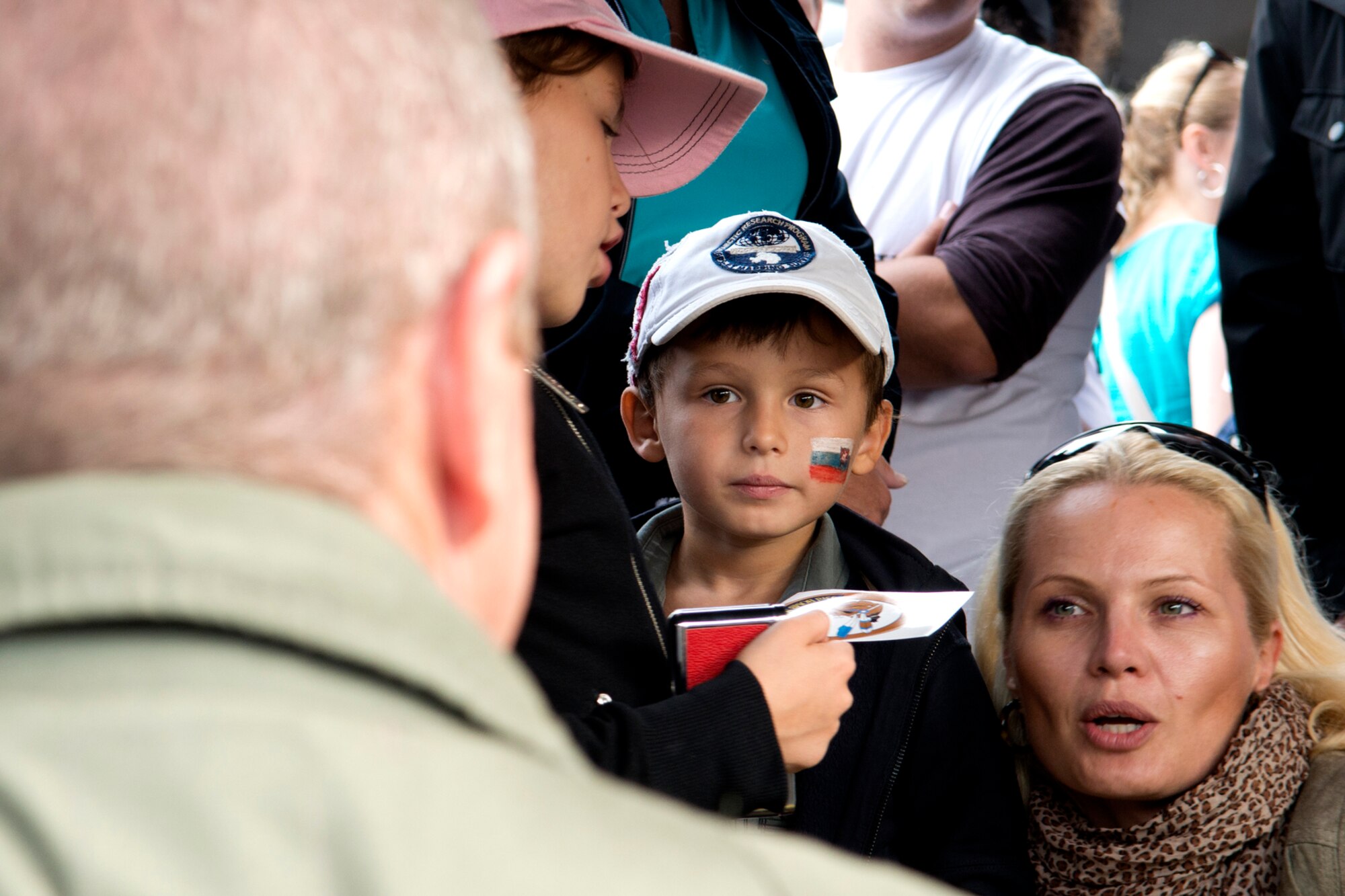 U.S. Air Force Master Sgt. Brandon Smith, 307th Aircraft Maintenance Squadron crew chief, is asked questions about the B-52H Stratofortress during the Slovak International Air Fest, Sept. 1, 2012, Sliac, Slovakia. The 307th Bomb Wing supported the air show by sending personnel and one B-52, which is assigned to the 93rd Bomb Squadron, Barksdale Air Force Base, La. (U.S. Air Force photo by Master Sgt. Greg Steele/Released)