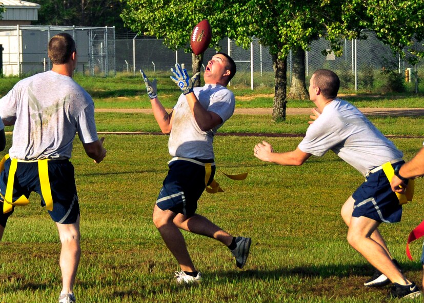 Airman 1st Class Kevin Kelsoe of the 919th Maintenance Squadron attempts a catch during a flag football game, part of the 919th Maintenance Group Olympics Sept. 8, 2012 at Duke Field, Fla.  The event featured 12 different team events aimed at boosting unit morale and team building.  (U.S. Air Force photo/Tech. Sgt. Cheryl Foster)