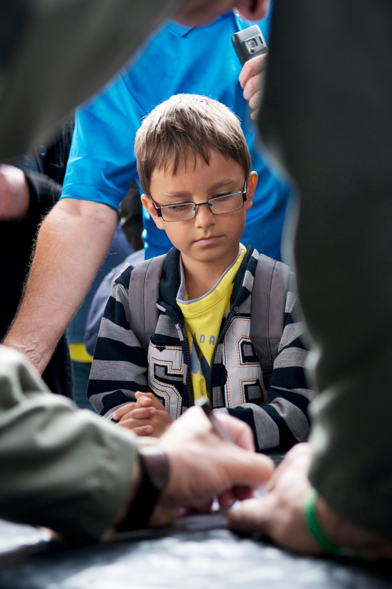 A boy waits for his picture of a B-52 to be signed by a 93rd Bomb Squadron aircrew member during the Slovak International Air Fest, Sept. 1, 2012, Sliac, Slovakia. The 93rd BS, assigned to the 307th Bomb Wing, Barksdale Air Force Base, La., supported the air show with personnel and one B-52H Stratofortress. (U.S. Air Force photo by Master Sgt. Greg Steele/Released)