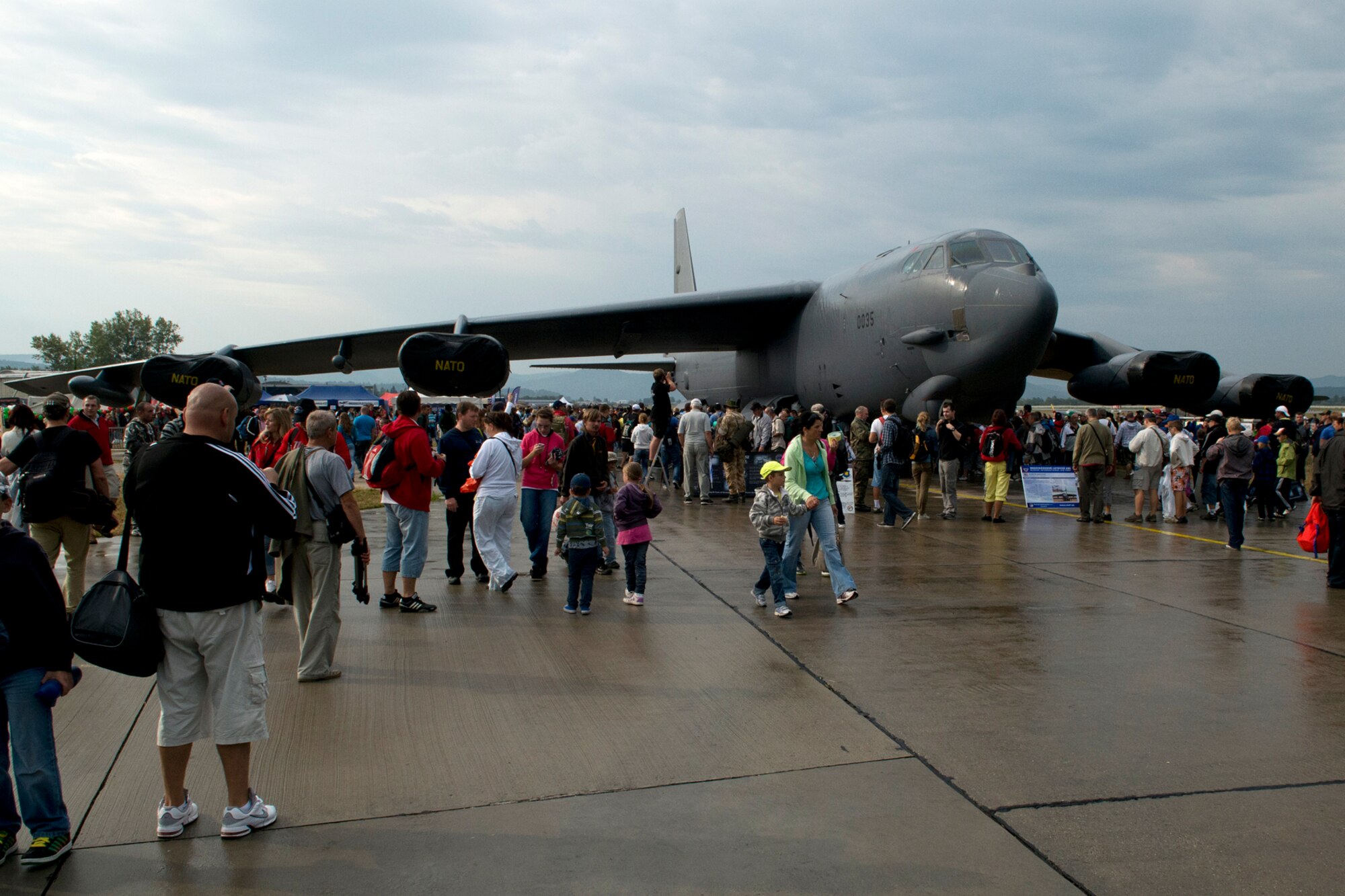 A crowd begins to gather around a 93rd Bomb Squadron B-52H Stratofortress despite rain showers that persisted throughout the first day of the Slovak International Air Fest, Sept. 1, 2012, Sliac, Slovakia. The 93rd BS B-52, assigned to the 307th Bomb Wing, Barksdale Air Force Base, La., made history by being the first B-52 to ever participate in SIAF. (U.S. Air Force photo by Master Sgt. Greg Steele/Released)