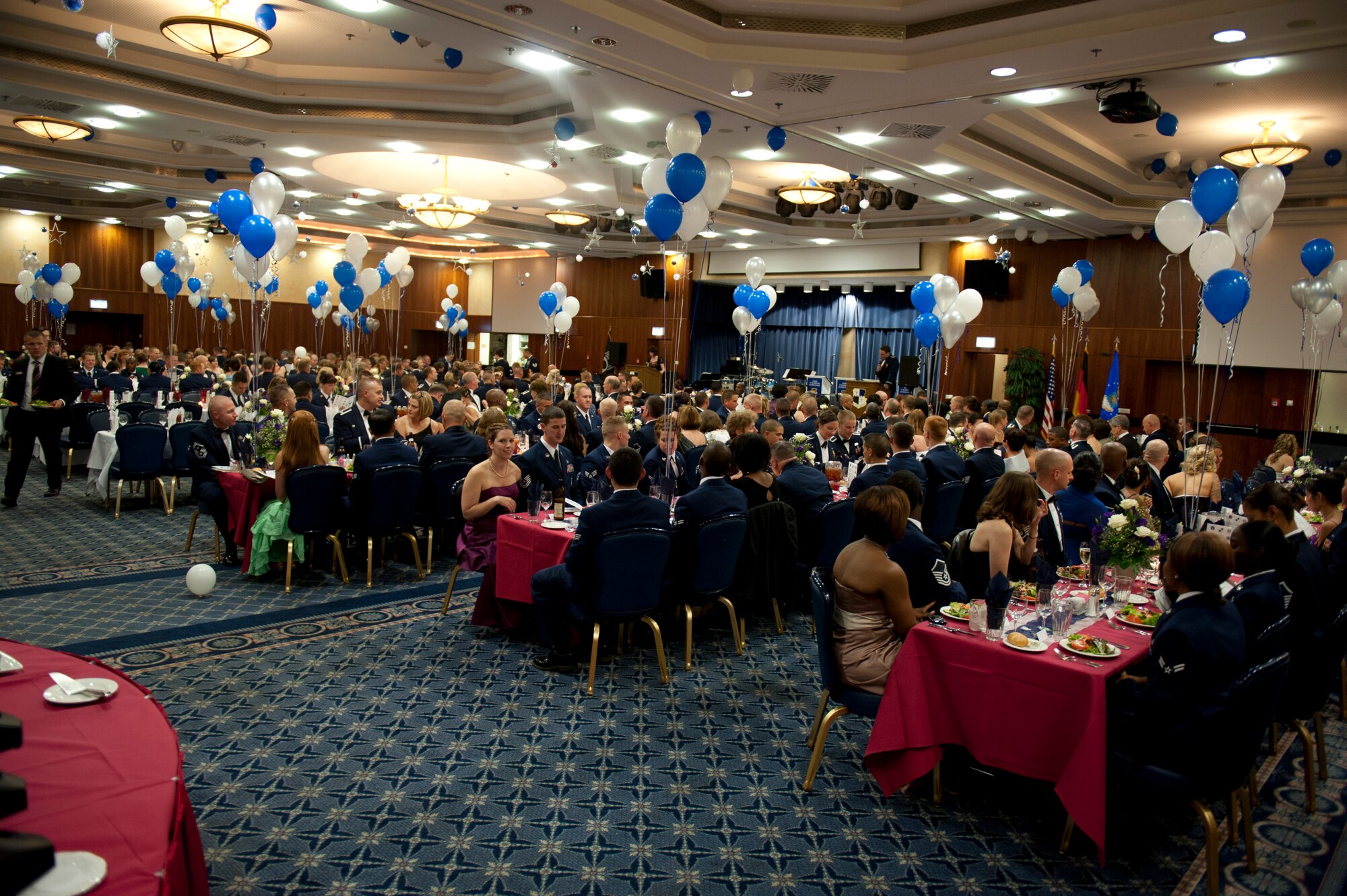 SPANGDAHLEM AIR BASE, Germany – Attendees of Spangdahlem’s Air Force ball congregate inside the Eifel Club Ballroom here Sept. 15.  The event was in celebration of the Air Force’s 65 years as an independent service with a theme of forging the future and honoring the past. (U.S. Air Force photo by Airman 1st Class Gustavo Castillo/Released)
