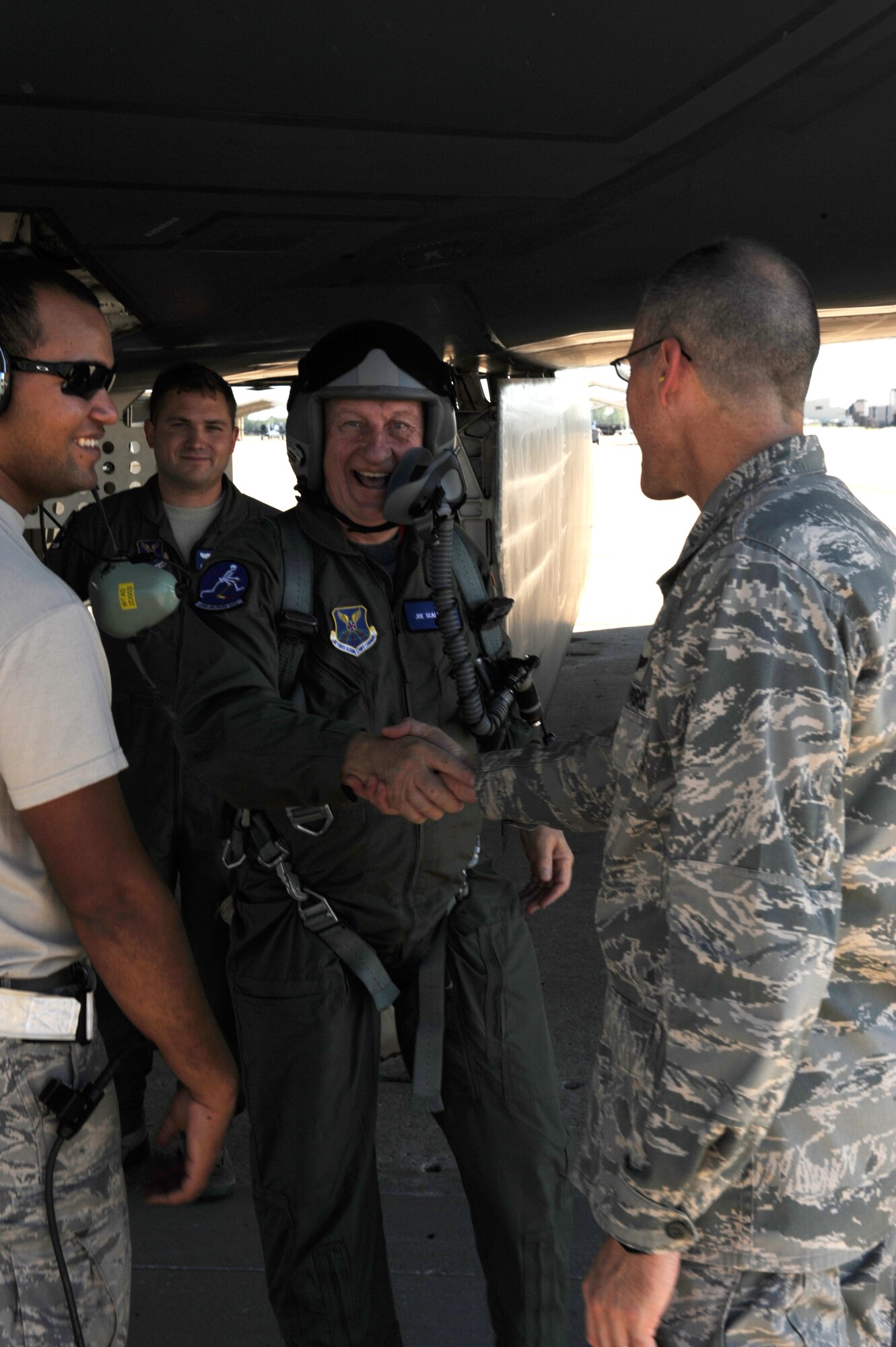 WHITEMAN AIR FORCE BASE, Mo. -- Brig. Gen. Thomas Bussiere, 509th Bomb Wing commander, greets Joe Scallorns, a board member of Whiteman Air Force Base's Community Council, after his B-2 incentive flight, Sept. 12. The purpose of the incentive flight was to provide Scallorns with a deeper understanding of the full spectrum of AFGSC, and a better understanding and appreciation for the quality Airmen and civilians who protect the nation every day. (U.S. Air Force photo/Airman 1st Class Bryan Crane) (Released)