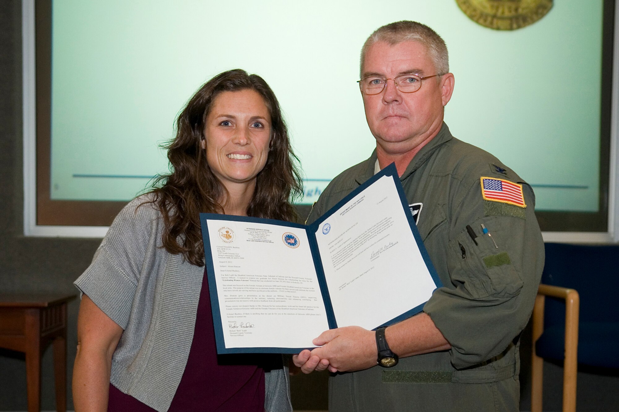 GRISSOM AIR RESERVE BASE, Ind. -- Allison Duncan, 434th Air Refueling Wing sexual assault response coordinator, is presented a letter of appreciation from Col. Don Buckley, 434th ARW commander, during a civilian commander's call here Sept. 13. The letter was sent from the Howard County Veterans Service Office, regarding a presentation she facilitated during a woman’s veterans retreat June 29 in Kokomo, Ind. (U.S. Air Force photo/Staff Sgt. Ben Mota)