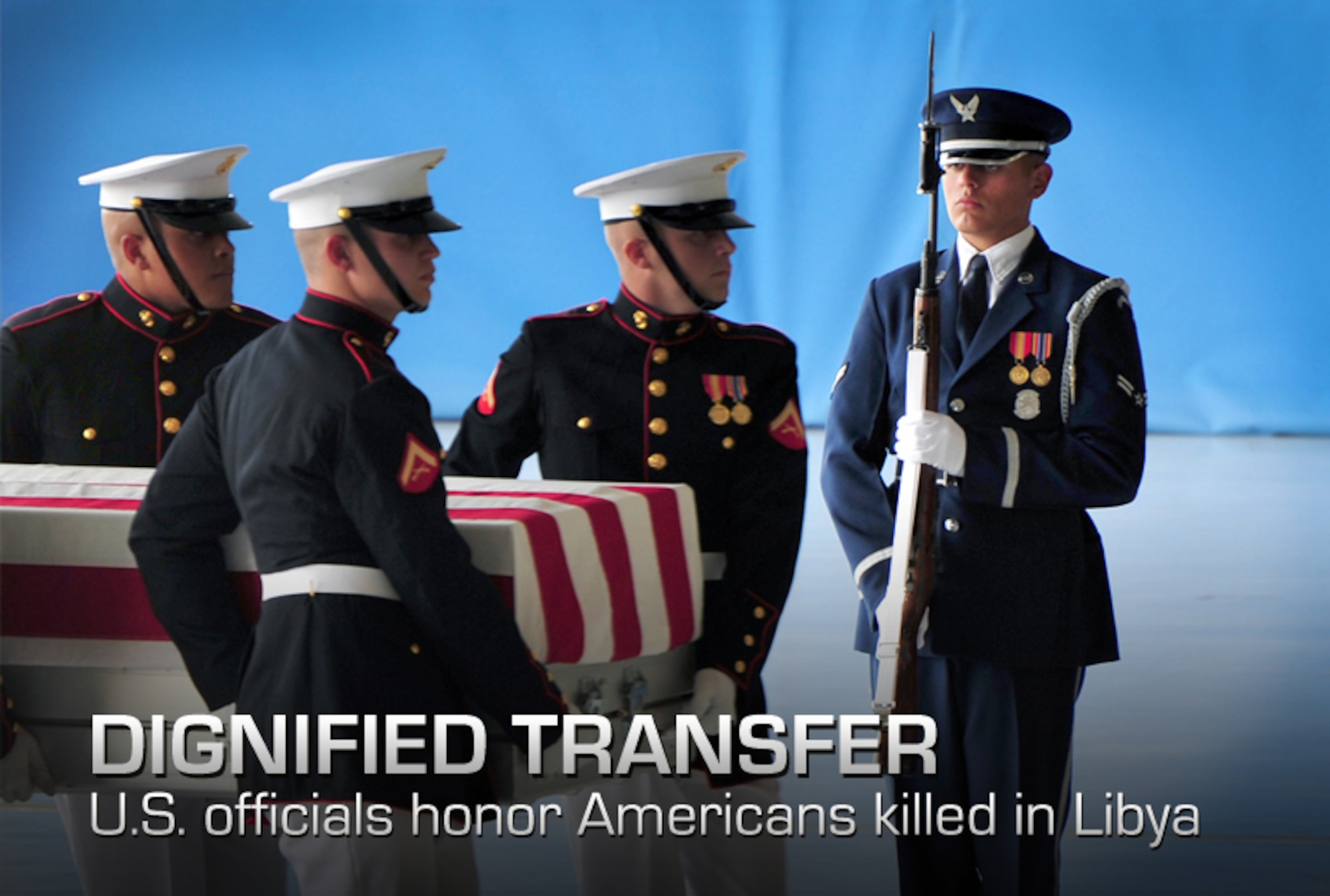 A U.S. Air Force Honor Guard ceremonial guardsman presents arms during a dignified transfer ceremony at Joint Base Andrews, Md., Sept. 14, 2012. Ceremonial guard members from all branches of the Department of Defense worked jointly to honor U.S. Foreign Service members killed during attacks to the U.S. consulate Sept. 11, 2012, in Benghazi, Libya. (U.S. Air Force photo/Senior Airman Steele C. G. Britton)