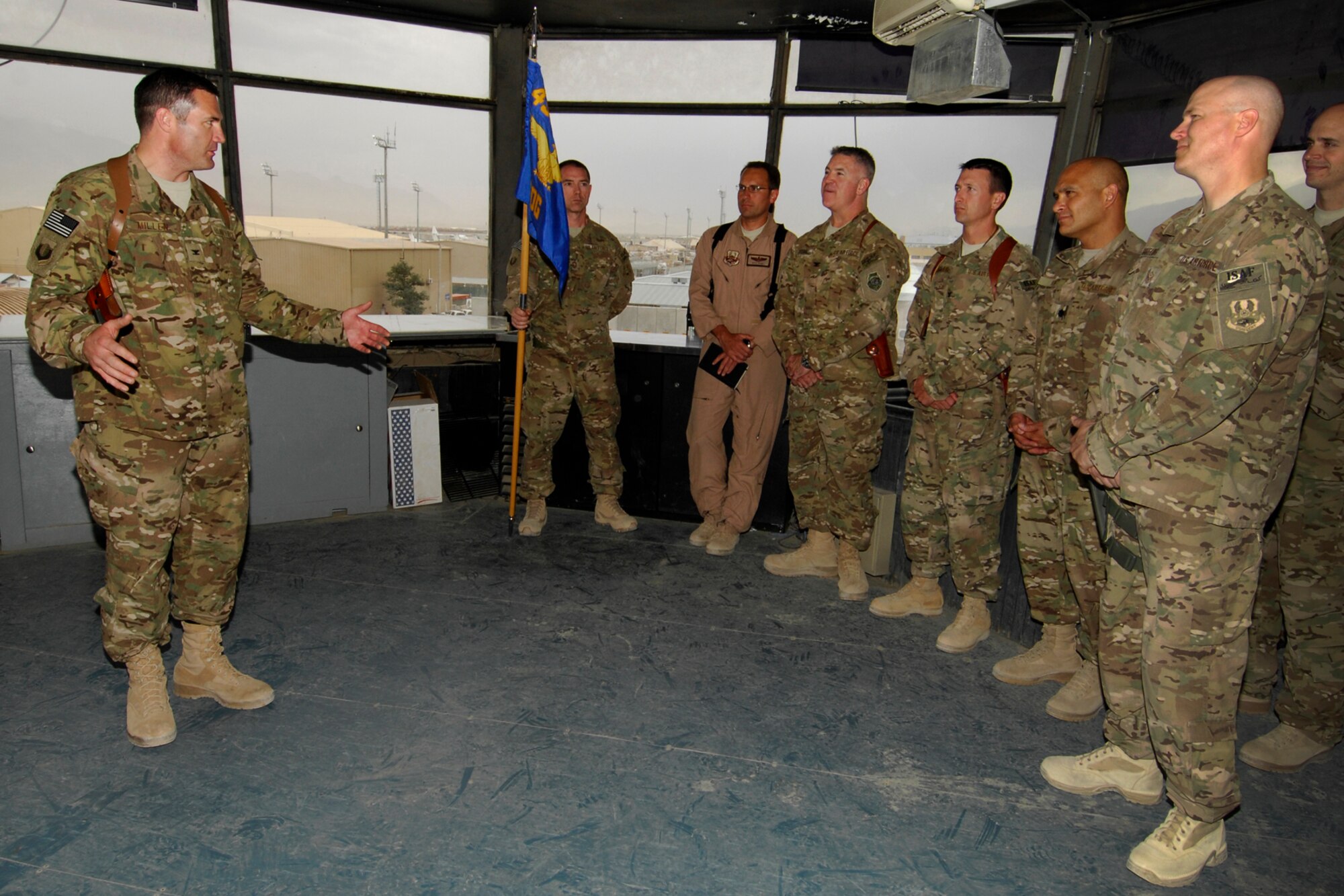Col. Michael Millen, 455th Expeditionary Operations Group commander, addresses an audience after assuming command of the group at Bagram Airfield, Afghanistan, Sept. 17, 2012. Millen now leads the team of Bagram Airmen responsible for delivering responsive and precise airpower to coalition forces in Afghanistan. (U.S. Air Force photo/SSgt Jeff Nevison)